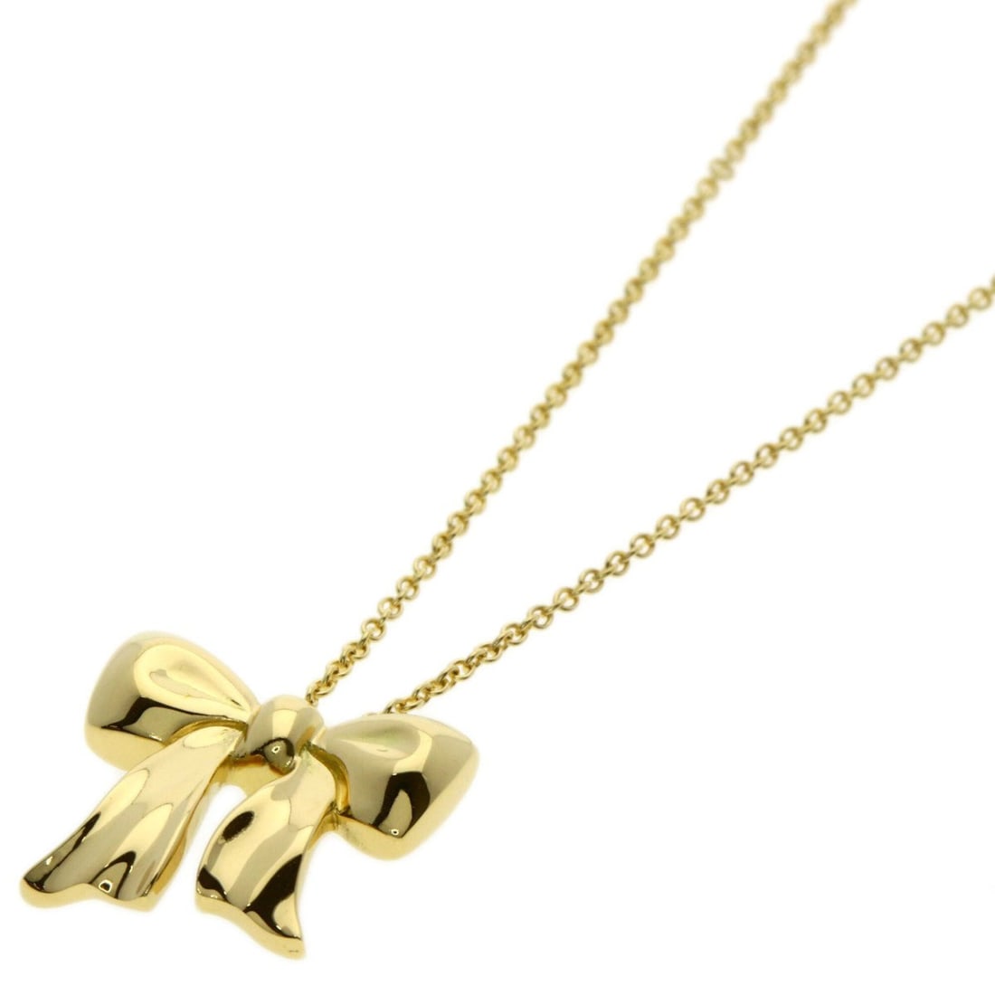 Tiffany & Co. Ribbon Necklace, 18K Yellow Gold, Women's.: --- Catalog ---Category: SizeWidth: 1.2mm / 0.05''Weight: 4.1g / 0.14oz.Pendant Size: 14mm x 15.3mm / 0.55'' x 0.6''Neck Circumference: 40.5 cm / 15.94''Category: DesignGender: WomenMaterial: Yellow g
