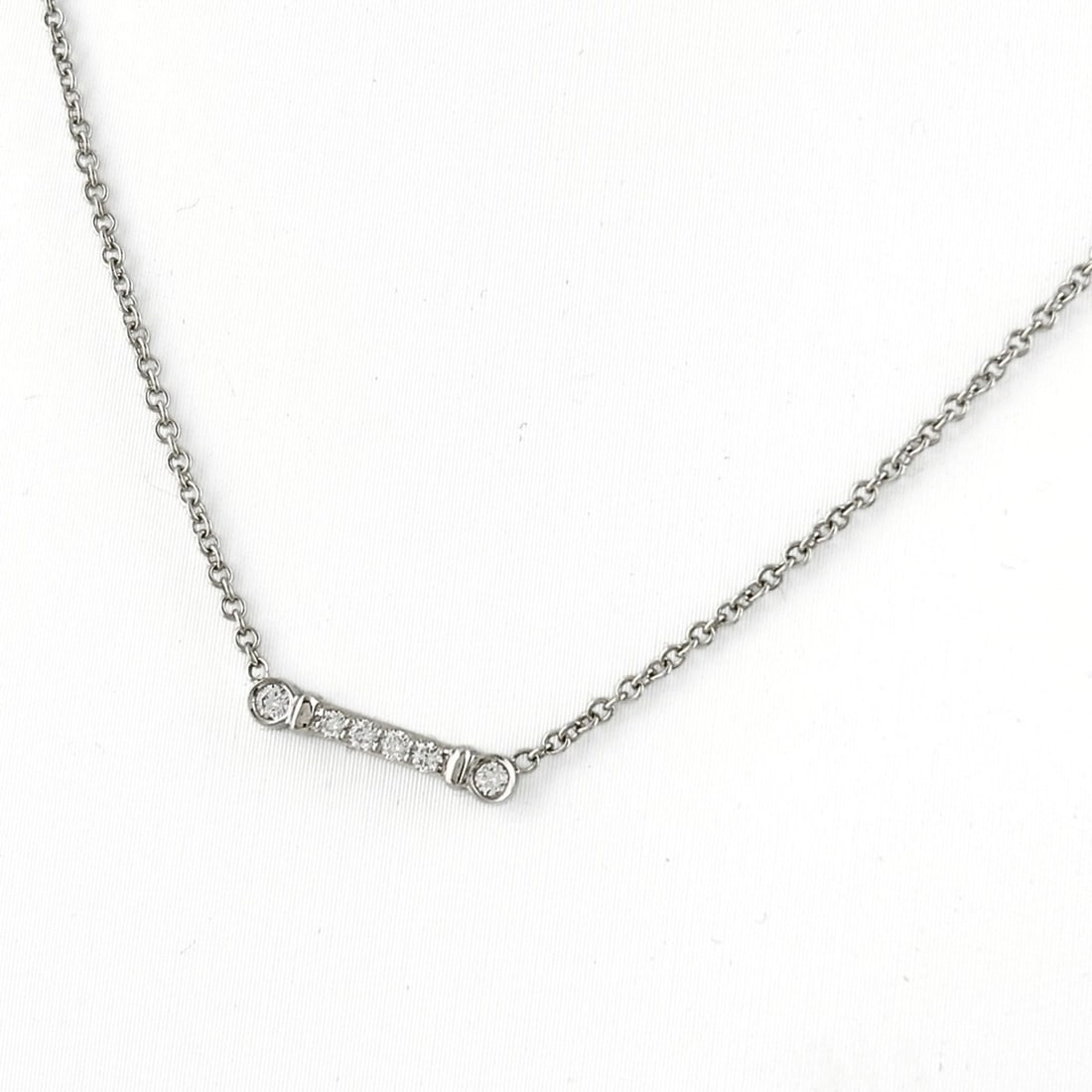 Tiffany & Co. Fleur de Lis Stem Necklace Pendant with Melee Diamonds, 750 Diamond Necklace, Women's: --- Catalog ---Category: SizePendant Size: 2.5mm x 13.3mm / 0.09'' x 0.52''Neck Circumference: 41 cm / 16.14''Category: DesignColor: SilverGender: WomenPendant Type: PendantNecklace Type: NecklaceCate