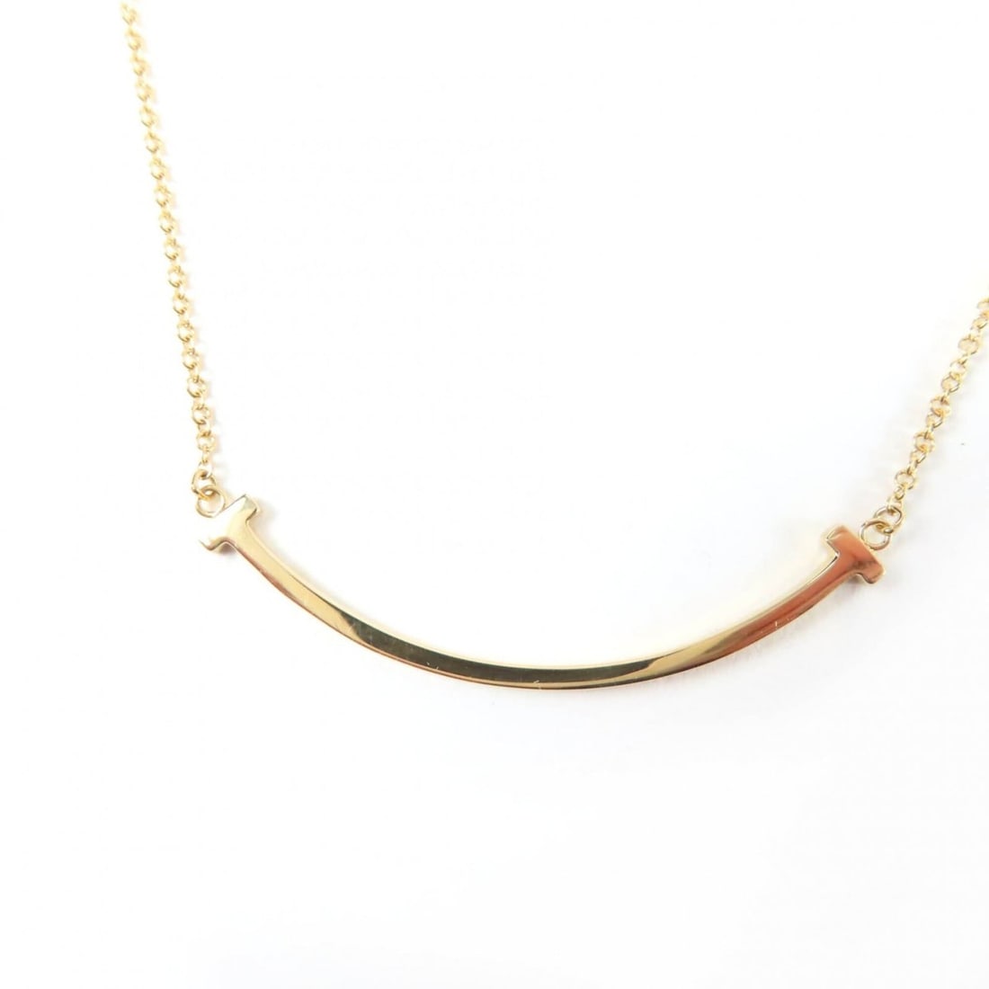 TIFFANY&Co. Tiffany T Smile Pendant Necklace AU750 (YG) Yellow Gold, Weight 2.8g, Women's: --- Catalog ---Category: SizeWeight: 2.8g / 0.09oz.Pendant Size: 36mm / 1.41''Neck Circumference: 41 cm - 45.5 cm / 16.14'' - 17.91''Category: DesignColor: Yellow goldGender: WomenMaterial: Yellow gol