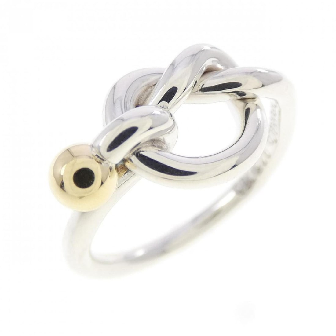 Tiffany Love Knot Ring: --- Catalog ---Category: SizeJP Size: 10.5US Size: 5.5Category: DesignType: Band ringGender: WomenMaterial: Silver 925, Yellow gold (18K)Category: GeneralBrand: Tiffany--- Item List ---Section: Condit