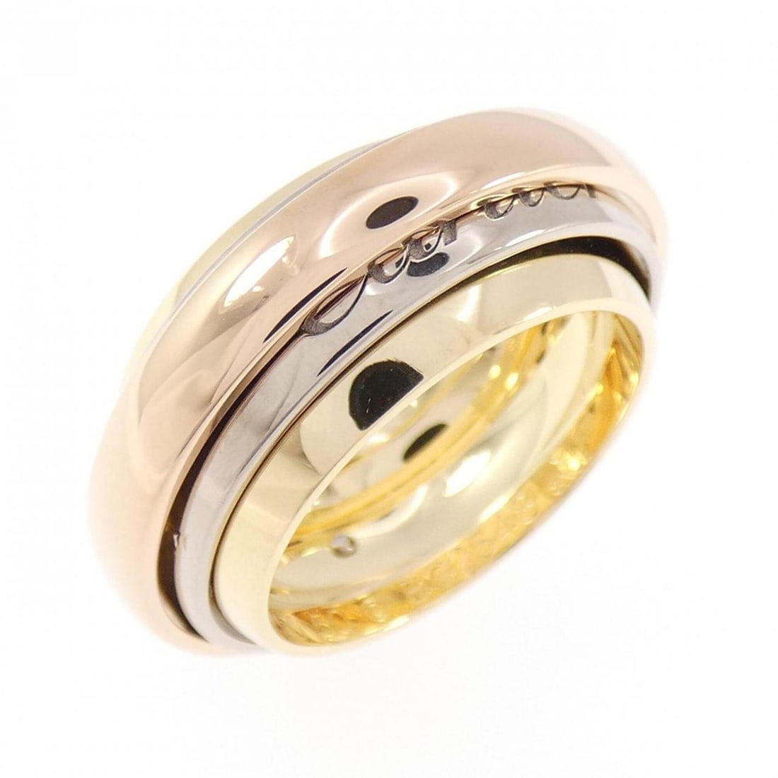 Cartier Trinity Must Essence 2002 Christmas Limited Edition Ring: --- Catalog ---Category: SizeWidth: 8.8mm / 0.35''Weight: 14.5g / 0.51oz.JP Size: 10US Size: 5.5Category: DesignType: Band ringGender: WomenMaterial: Pink gold (18K), White gold (18K), Yellow gold (18