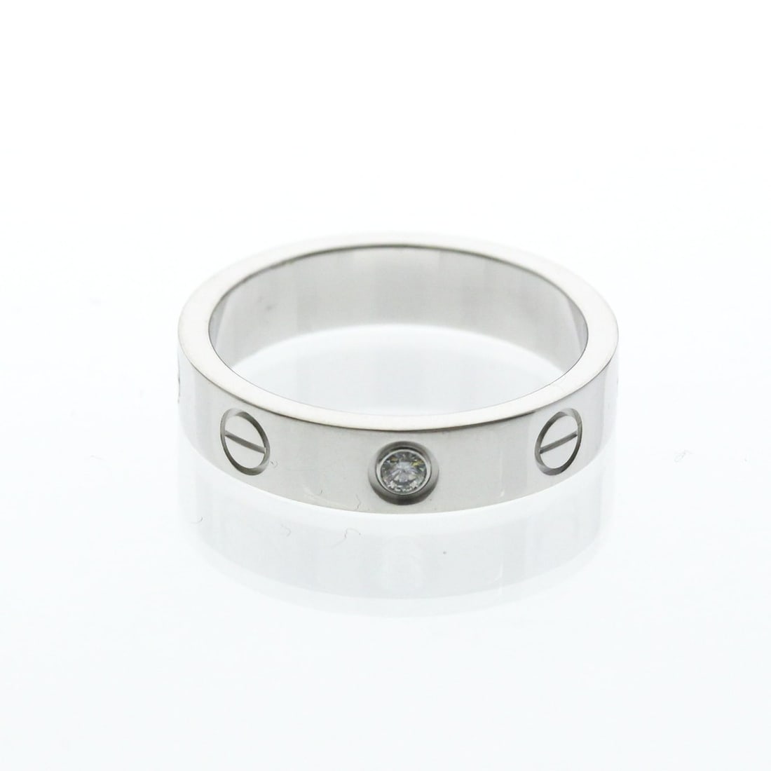 Cartier Mini Love Ring With 1 Diamond White Gold (18K) Fashion Diamond Band Ring Silver: --- Catalog ---Category: SizeWidth: 4mm / 0.16''Weight: 4.6g / 0.16oz.JP Size: 9US Size: 4 3/4Brand Size: 49Category: DesignType: Band ringColor: SilverMetal: White GoldStone: DiamondStyle: FashionGen