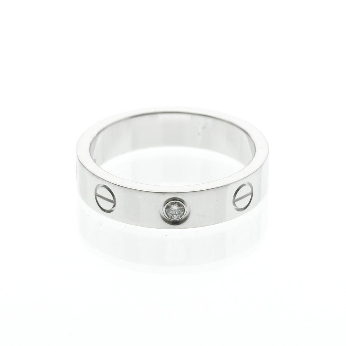 Cartier Mini Love Ring With 1 Diamond White Gold (18K) Fashion Diamond Band Ring Silver: --- Catalog ---Category: SizeWidth: 4mm / 0.16''Weight: 3.8g / 0.13oz.JP Size: 9US Size: 4 3/4Brand Size: 49Category: DesignType: Band ringColor: SilverMetal: White GoldStone: DiamondStyle: FashionGen
