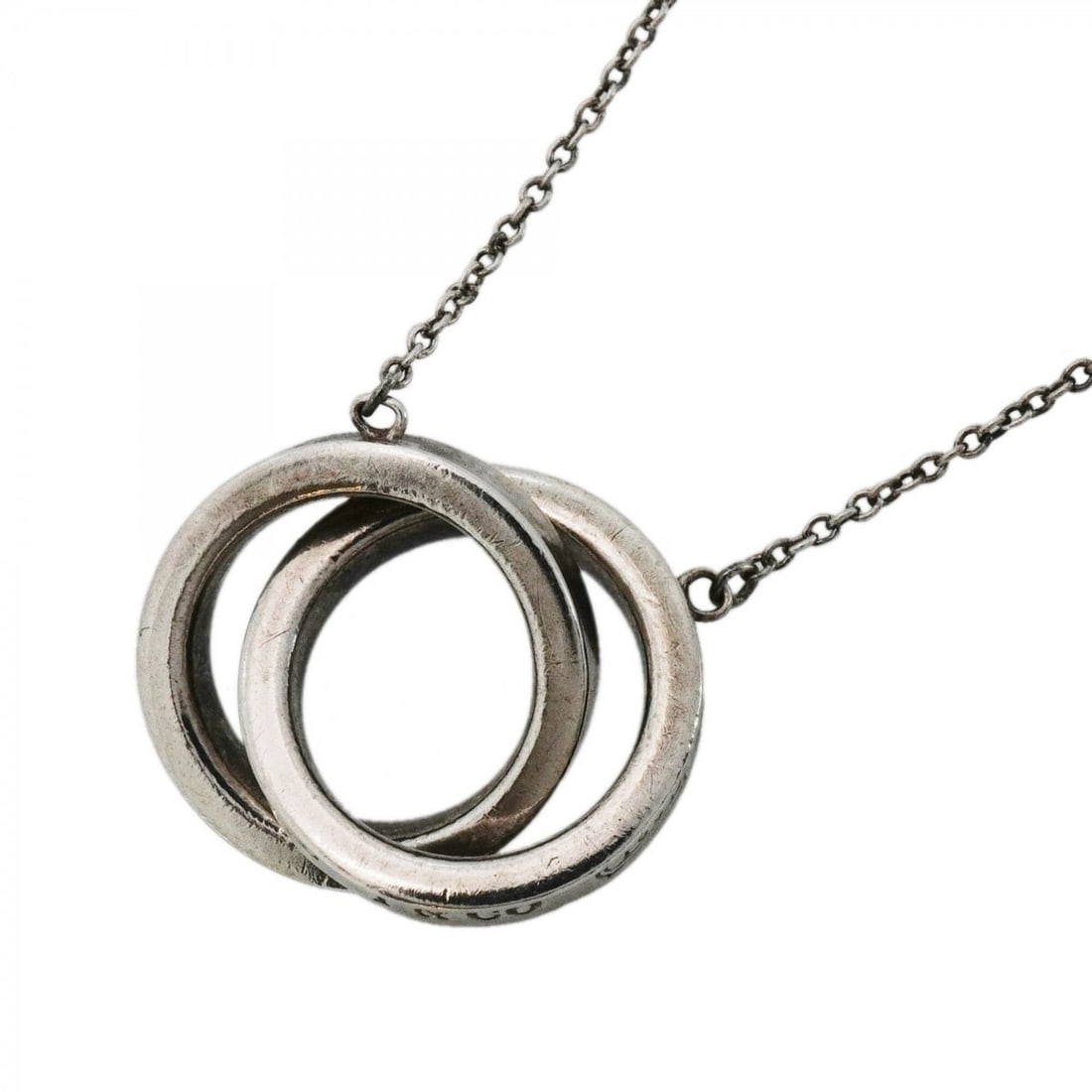 Tiffany & Co. Interlocking Necklace 1837, Sterling Silver 925, Women's: --- Catalog ---Category: SizePendant Size: 14mm x 20.8mm / 0.55'' x 0.81''Neck Circumference: 41 cm / 16.14''Category: DesignGender: WomenMaterial: Silver 925Necklace Type: NecklaceCategory: GeneralBr