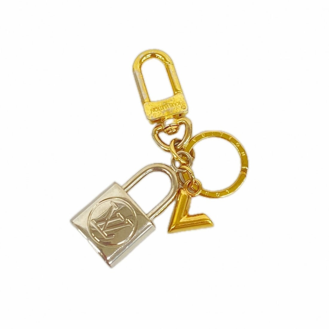 Louis Vuitton Kaleido V Padlock Keychain Charm M67376 Gold Silver Women's: --- Catalog ---Category: SizeSize (HxWxD): 10.2cm x 2.5cm x 1cm / 4.01'' x 0.98'' x 0.39''Category: DesignType: KeyringColor: Gold, SilverGender: WomenCategory: GeneralMPN: M67376Brand: Louis Vuitton-