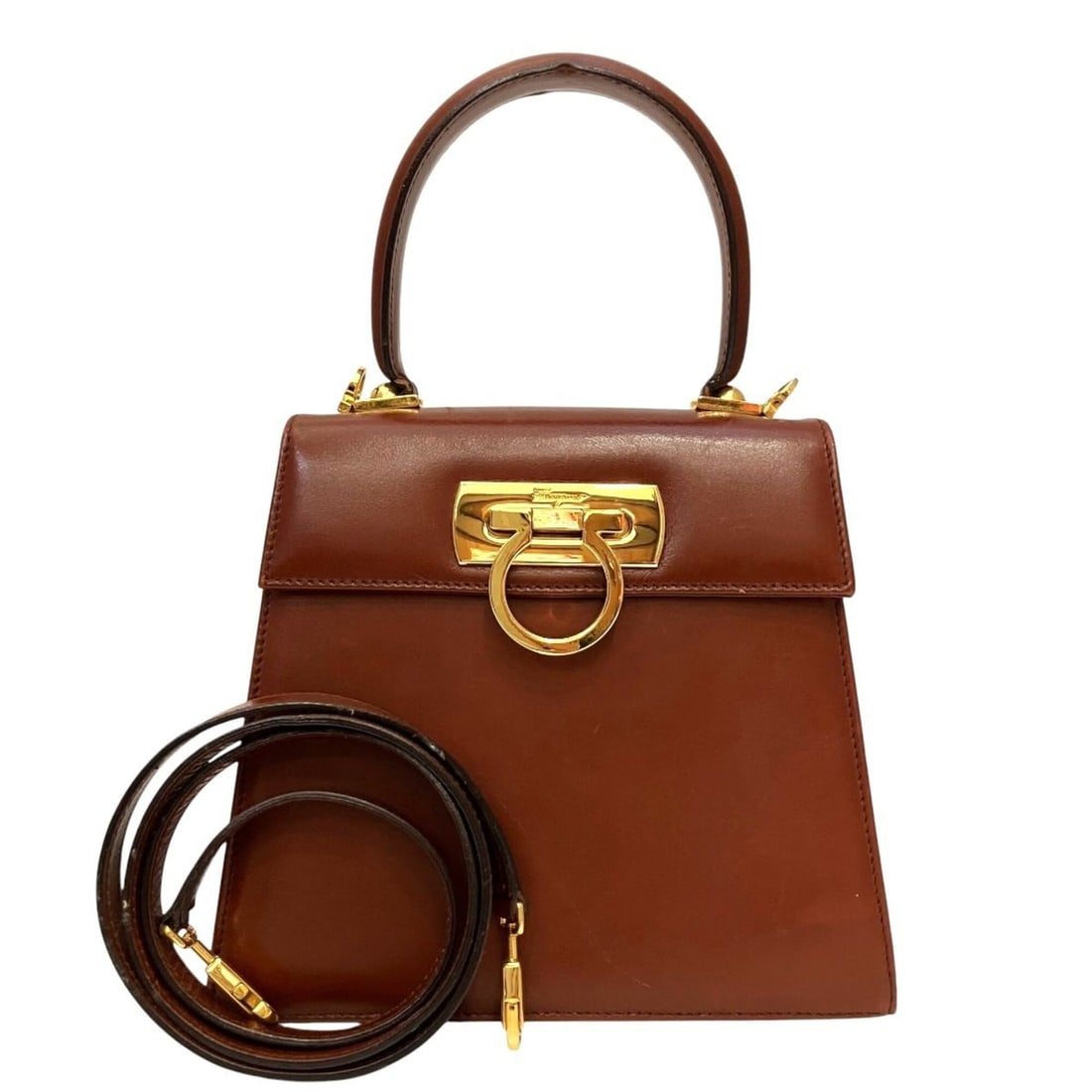 Salvatore Ferragamo handbag, Gancini design, calf leather, 21-2193: --- Catalog ---Category: SizeSize (HxWxD): 18cm x 20cm x 9cm / 7.08'' x 7.87'' x 3.54''Strap Length: 107cm / 42.12''Handle Length: 25cm / 9.84''Category: DesignType: HandbagColor: BrownGender: WomenCl