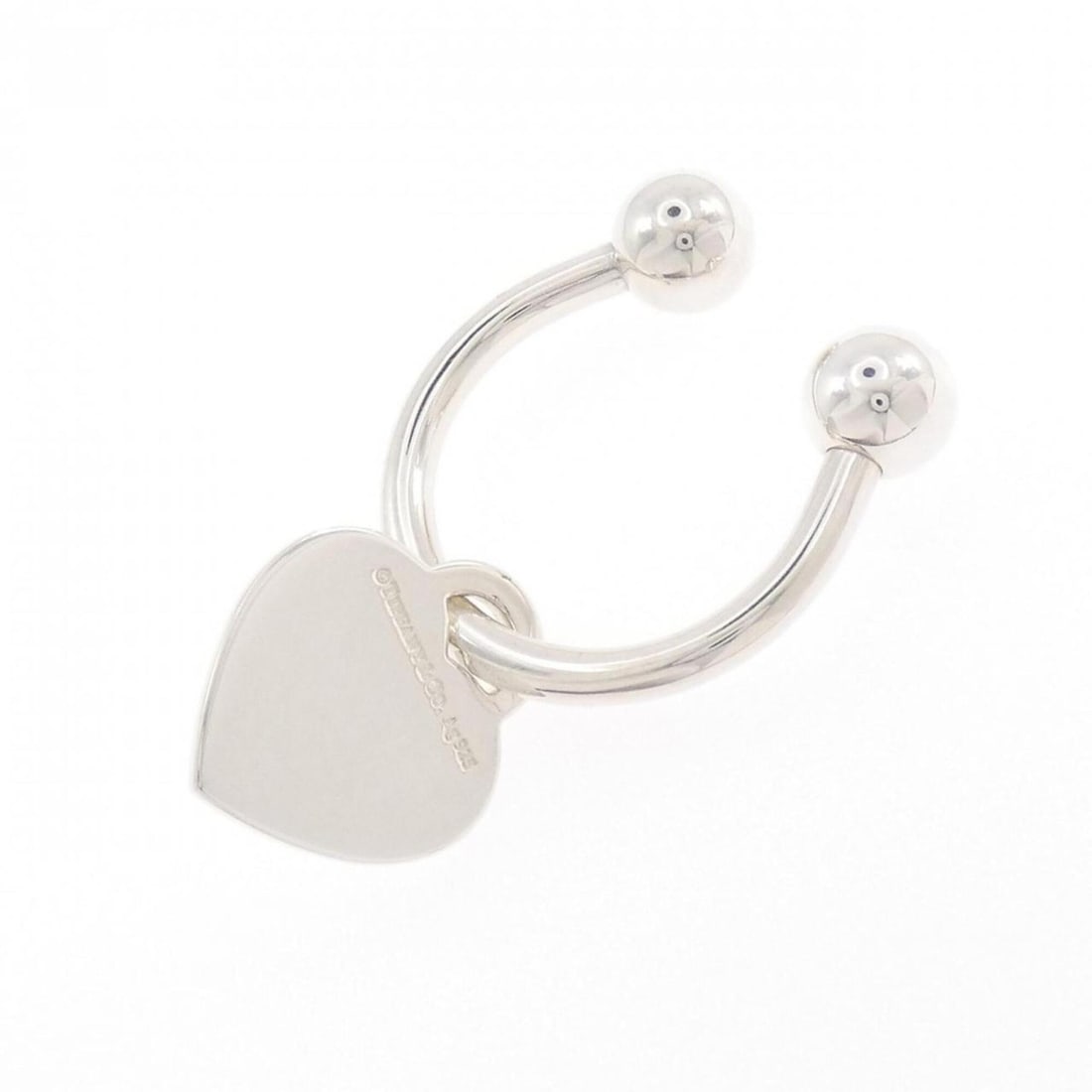 Tiffany 925 Keyring: --- Catalog ---Category: SizeWeight: 21.1g / 0.74oz.Size (HxWxD): 5.37cm x 2.08cm / 2.11'' x 0.81''Category: DesignType: KeyringGender: WomenMaterial: Silver 925Category: GeneralBrand: Tiffany--- Item