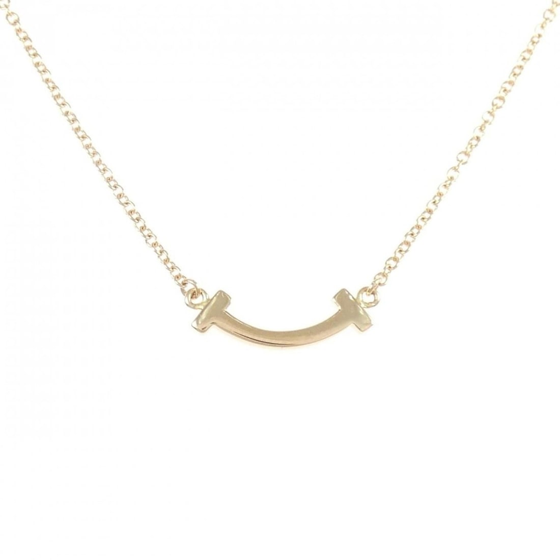 Tiffany T Smile Mini Necklace: --- Catalog ---Category: SizePendant Size: 3.5mm x 14.4mm / 0.13'' x 0.56''Neck Circumference: 40 cm - 46 cm / 15.74'' - 18.11''Category: DesignColor: Pink goldGender: WomenMaterial: Pink gold (18K)Pe