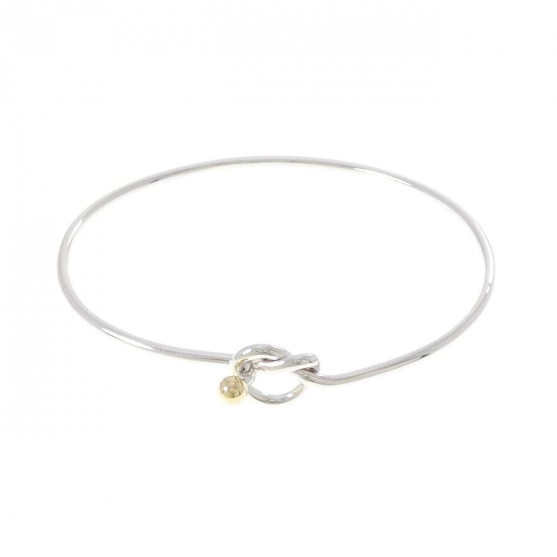 Tiffany & Co. Flat Wire Hook Eye Heart Bangle: --- Catalog ---Category: SizeLength: 17.5cm / 6.88''Category: DesignType: Charm braceletGender: WomenMaterial: Silver 925, Yellow gold (18K)Category: GeneralBrand: Tiffany--- Item List ---Section: Con