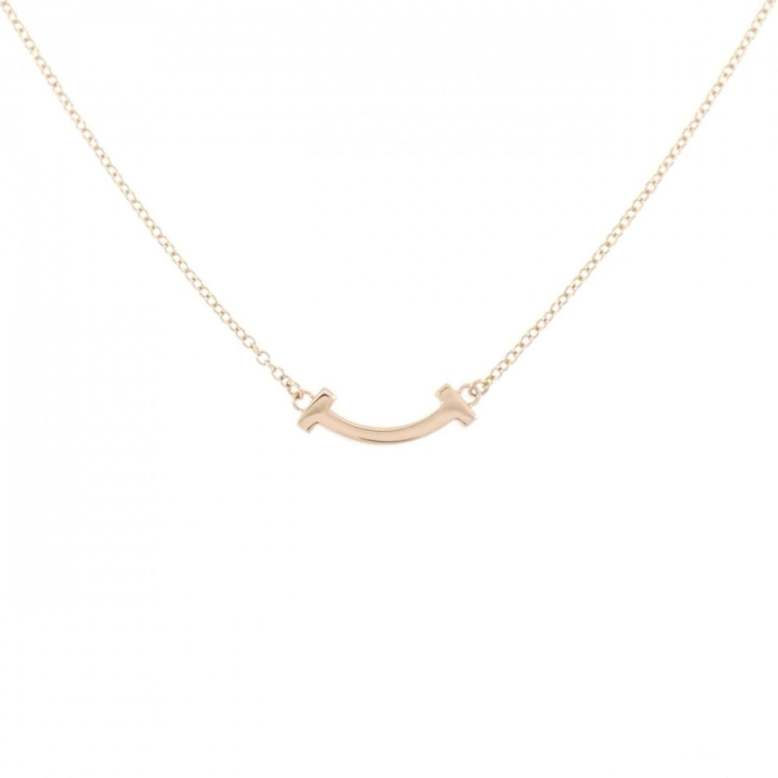 Tiffany T Smile Mini Necklace: --- Catalog ---Category: SizePendant Size: 3.6mm x 13.4mm / 0.14'' x 0.52''Neck Circumference: 41 cm - 46 cm / 16.14'' - 18.11''Category: DesignGender: WomenMaterial: Pink gold (18K)Pendant Type: Pend