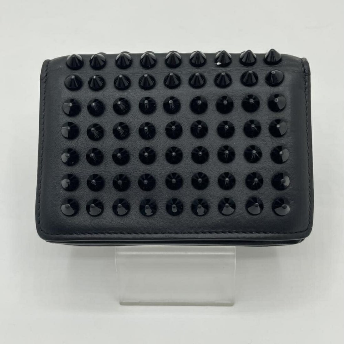 Christian Louboutin Studded Business Card Holder/Card Case: --- Catalog ---Category: DesignType: Business card caseColor: BlueGender: WomenMaterial: Leather Category: GeneralBrand: Christian LouboutinCategory: Physical PropertiesSize (HxWxD): 7.5cm x 10.5cm / 