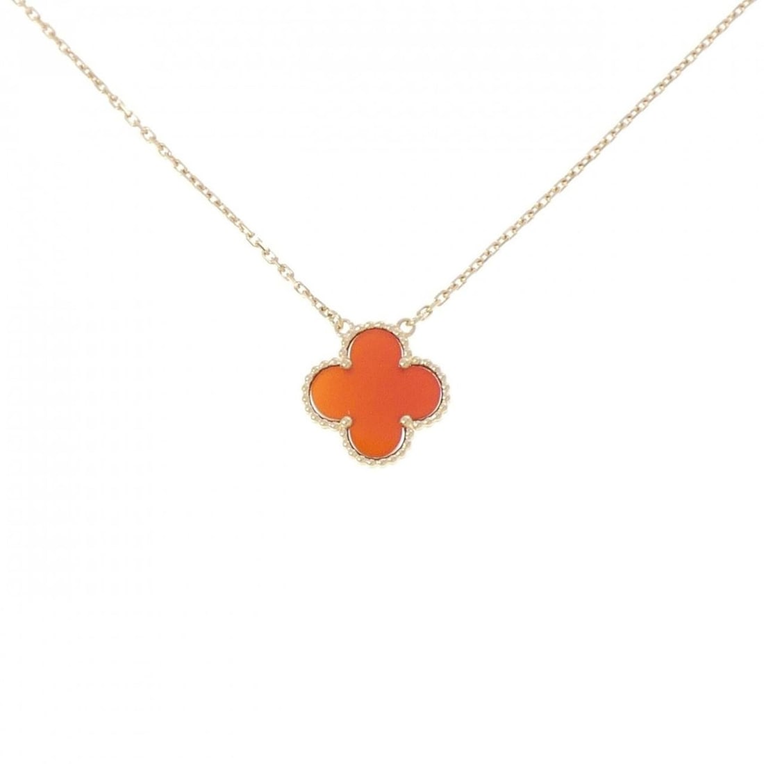 Van Cleef & Arpels Vintage Alhambra Necklace: --- Catalog ---Category: SizePendant Size: 14.5mm x 14.7mm / 0.57'' x 0.57''Neck Circumference: 37 cm - 41 cm / 14.56'' - 16.14''Category: DesignStone: CarnelianGender: WomenMaterial: Yellow gold (18K