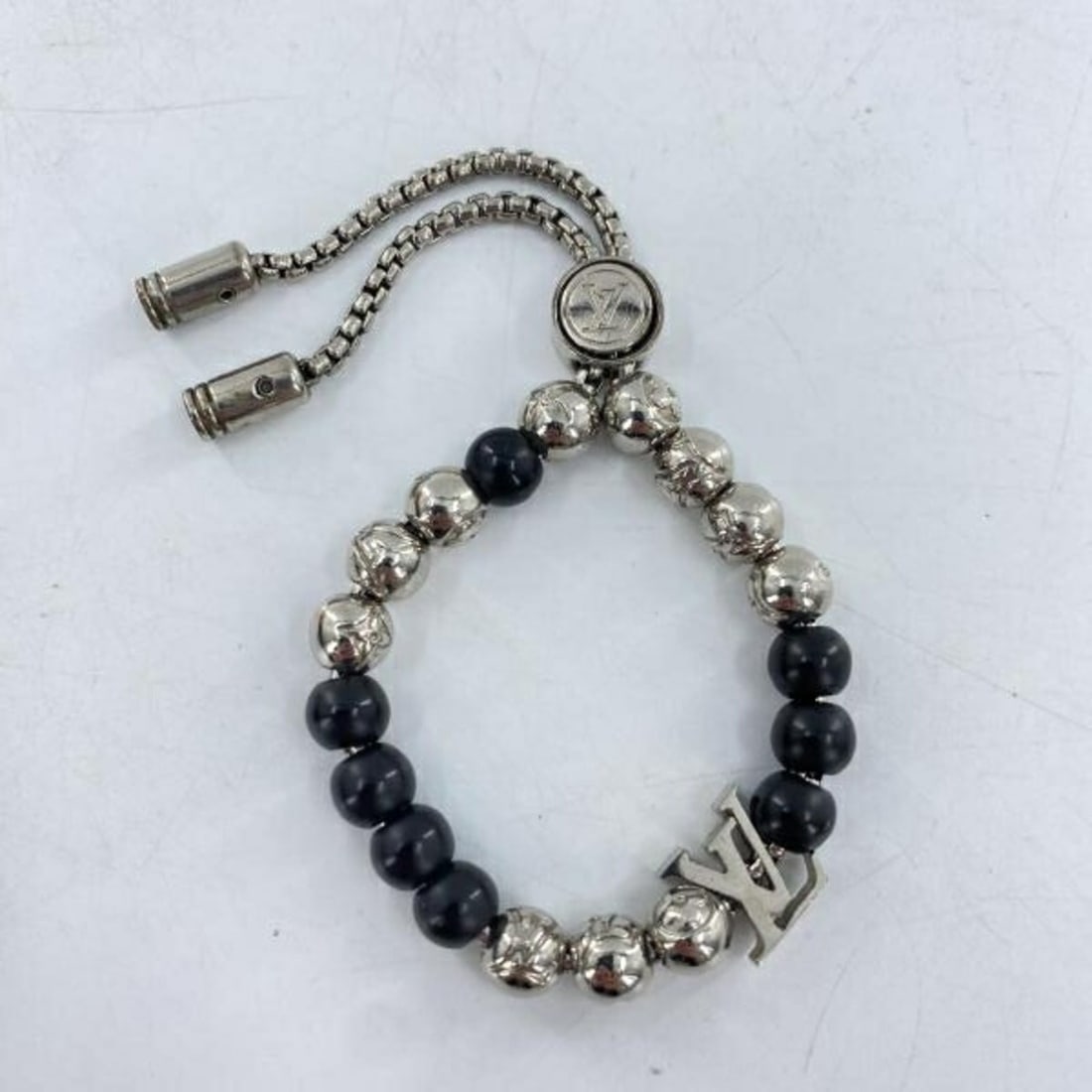 LOUIS VUITTON Monogram Bead Bracelet M00512 Silver Black Louis Vuitton: --- Catalog ---Category: SizeStone Diameter: 22cm / 8.66''Category: DesignType: Charm braceletColor: Black, Blue, MonogramGender: WomenMaterial: MonogramCategory: GeneralLine: MonogramBrand: Louis