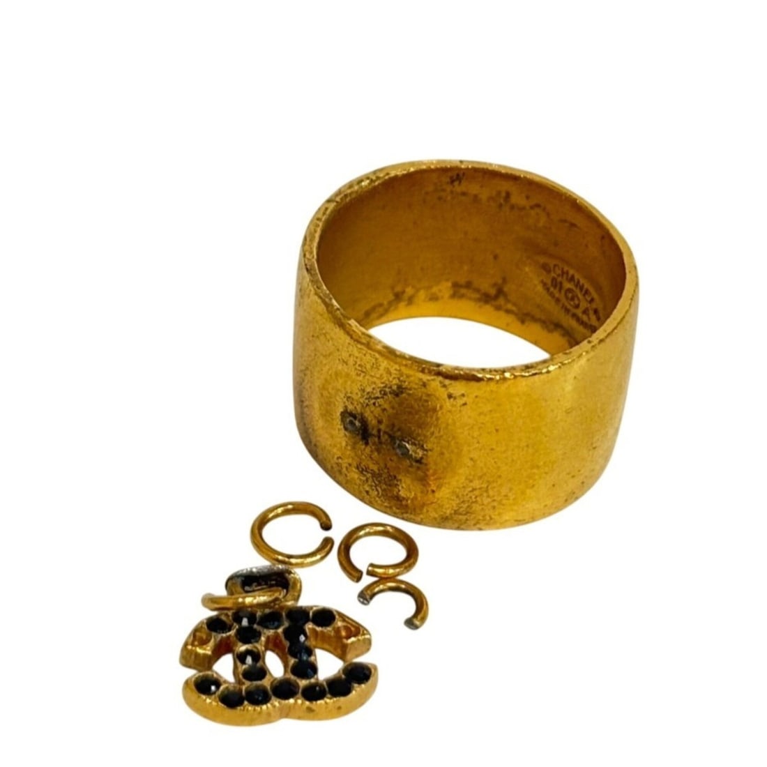 CHANEL 01A Rhinestone Coco Mark Ring (Size 12): --- Catalog ---Category: SizeWidth: 20mm / 0.79''JP Size: 12US Size: 6.5Category: DesignType: Band ringColor: Black, GoldStone: RhinestoneFinish: Gold platedGender: WomenCategory: GeneralBrand: Chanel