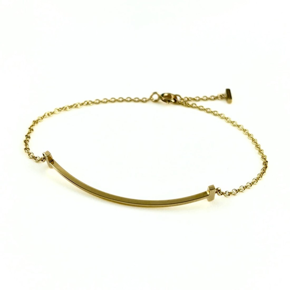 Tiffany & Co. T Smile Bracelet YG Yellow Gold 750 for Women: --- Catalog ---Category: SizeWidth: 5.5mm / 0.21''Length: 16.5cm / 6.49''Weight: 2.5g / 0.08oz.Category: DesignType: Charm braceletColor: Yellow goldGender: WomenMaterial: Yellow gold (18K)Category: G