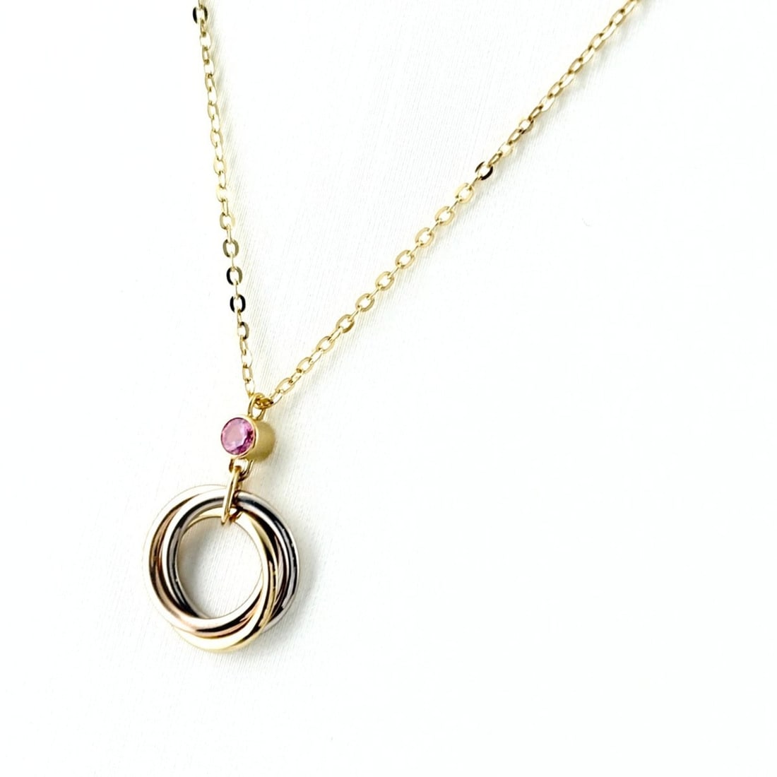 Cartier Trinity Necklace, available in yellow gold (YG), pink (PG), and white (WG). Three-color: --- Catalog ---Category: SizeWidth: 0.6mm / 0.02''Weight: 2.4g / 0.08oz.Pendant Size: 15.8mm x 10.1mm / 0.62'' x 0.39''Neck Circumference: 39.5 cm / 15.55''Category: DesignStone: SapphireGender: Women