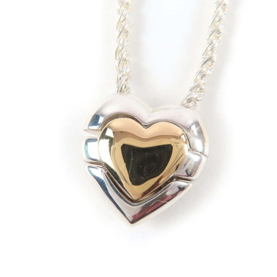 TIFFANY&Co. Tiffany 925 Puzzle Heart Necklace Pendant, Silver and Gold, with Box Dust Bag, Weight: --- Catalog ---Category: SizePendant Size: 1.7mm x 1.7mm / 0.06'' x 0.06''Neck Circumference: 41.5 cm / 16.33''Category: DesignColor: Gold, SilverGender: WomenMaterial: Silver 925Pendant Type: Pendant