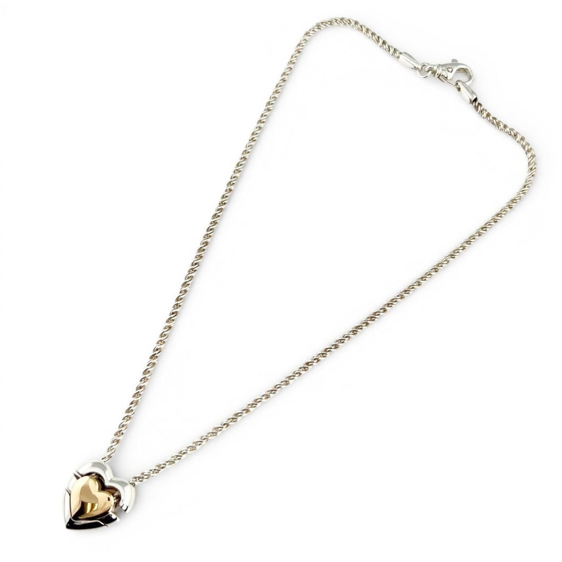 TIFFANY&Co. Tiffany Vintage 925 750 Double Heart Puzzle Necklace, Silver and Gold, Made in Italy,: --- Catalog ---Category: SizeWeight: 22.9g / 0.8oz.Pendant Size: 20mm x 18mm / 0.78'' x 0.7''Neck Circumference: 36 cm / 14.17''Category: DesignColor: Gold, SilverGender: WomenSeason: VintageMaterial: