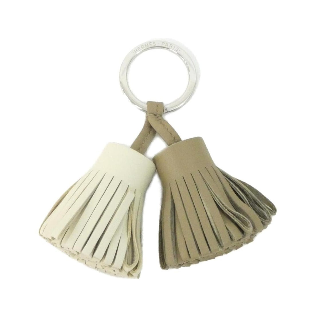 Hermes Carmen Unodos 077895CJ Keyring: --- Catalog ---Category: DesignType: KeyringColor: BeigeGender: Women,MenMaterial: Agneau MiloCategory: GeneralBrand: Hermes--- Item List ---Section: ConditionRanking: Rank A Used - A few traces of