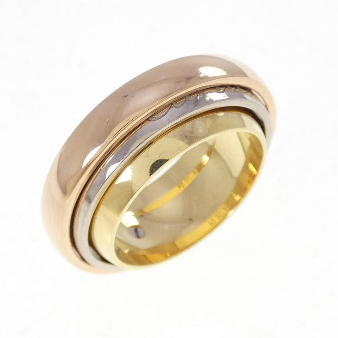 Cartier Trinity Must Essence 2002 Christmas Limited Edition Ring: --- Catalog ---Category: SizeWidth: 8.9mm / 0.35''Weight: 20g / 0.7oz.JP Size: 12US Size: 6.5Category: DesignType: Band ringGender: WomenMaterial: Pink gold (18K), White gold (18K), Yellow gold (18K)C