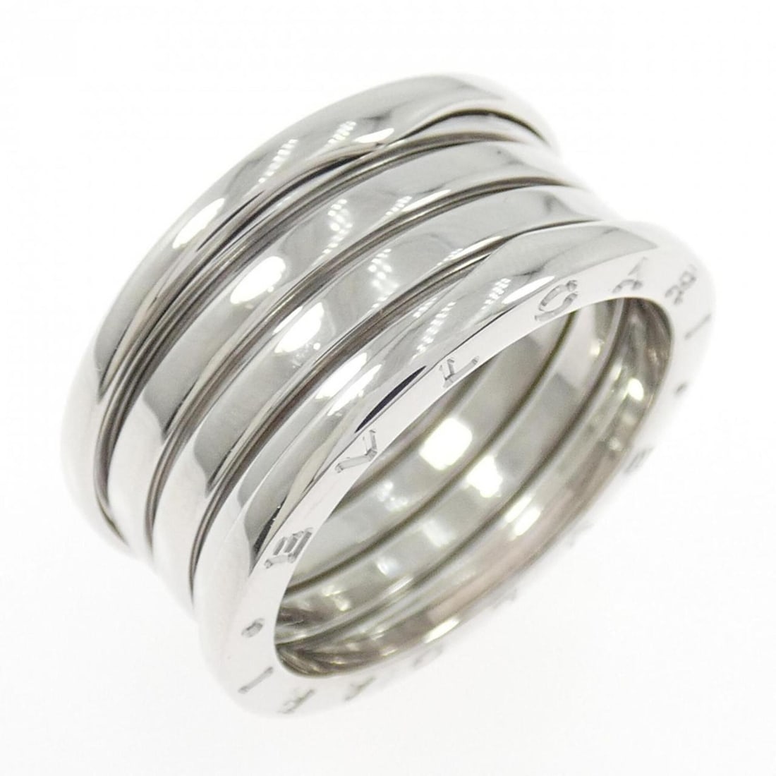 Bvlgari B.zero1 4-band ring: --- Catalog ---Category: SizeWidth: 11.7mm / 0.46''Weight: 12.9g / 0.45oz.JP Size: 23US Size: 11Category: DesignType: Band ringGender: MenMaterial: White gold (18K)Category: GeneralLine: