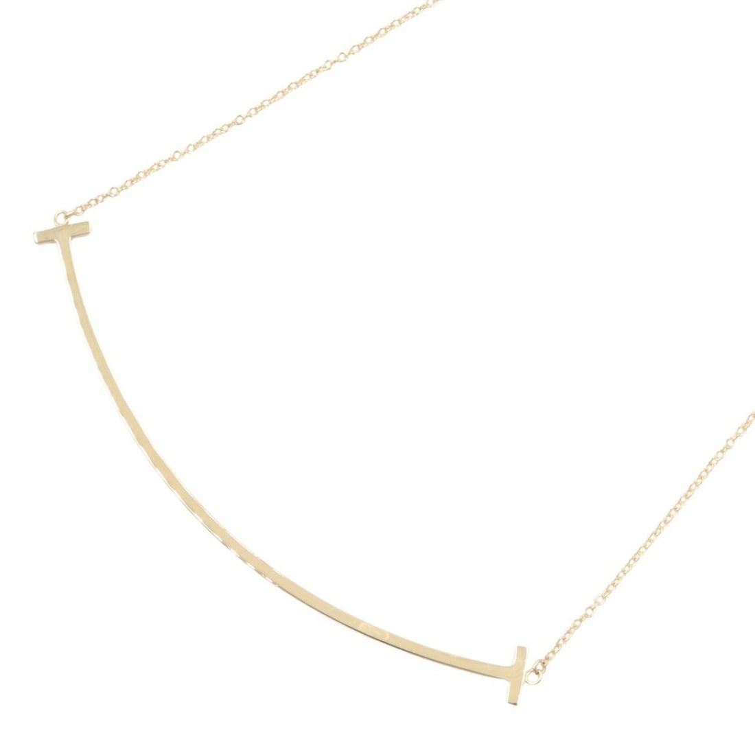 Tiffany & Co. T Smile Large Necklace, 18K (Yellow Gold), Women's Jewelry, Gold Tone: --- Catalog ---Category: SizePendant Size: 6mm x 70mm / 0.23'' x 2.75''Neck Circumference: 41 cm - 46 cm / 16.14'' - 18.11''Category: DesignColor: GoldGender: WomenMaterial: Yellow gold (18K)Necklace 