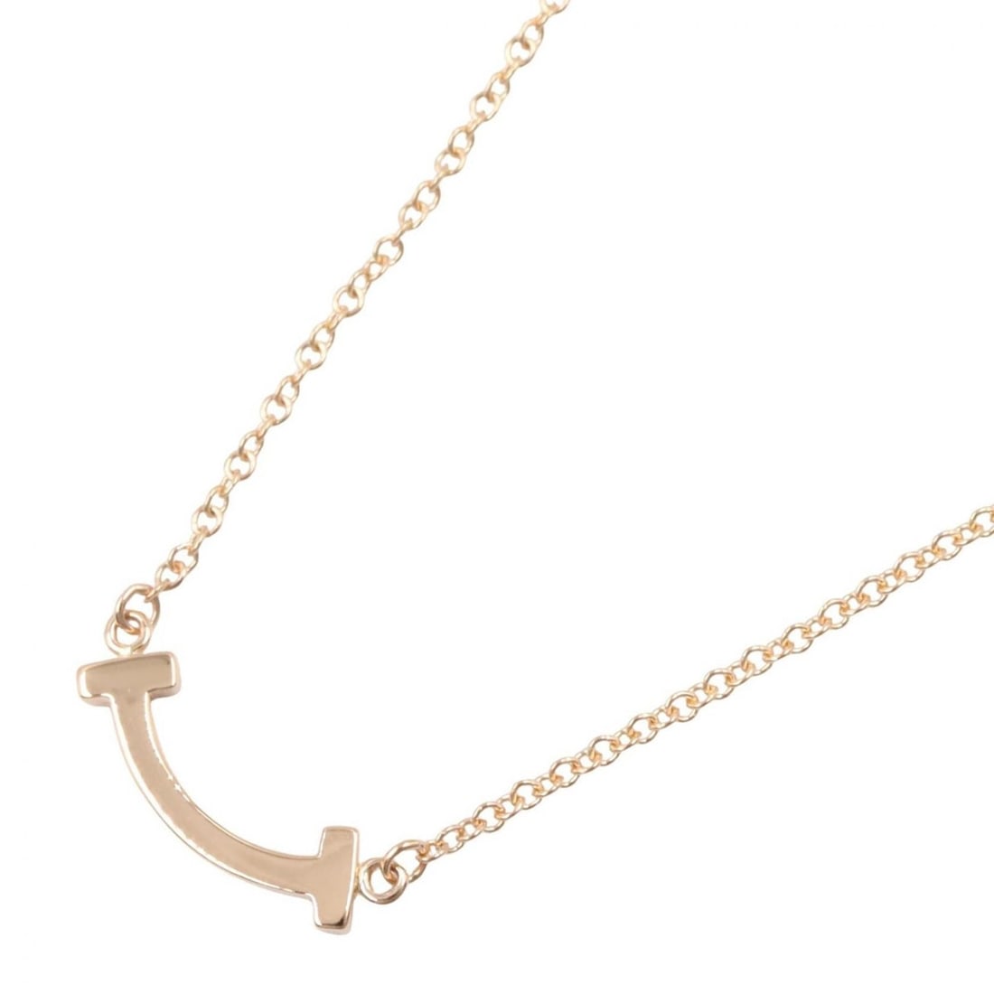 Tiffany & Co. T Smile Mini Necklace, 18K Pink Gold (PG), Women's Jewelry, Tone: --- Catalog ---Category: SizePendant Size: 3mm x 14mm / 0.11'' x 0.55''Neck Circumference: 40.5 cm - 45.5 cm / 15.94'' - 17.91''Category: DesignColor: GoldGender: WomenMaterial: Pink gold (18K)Necklac