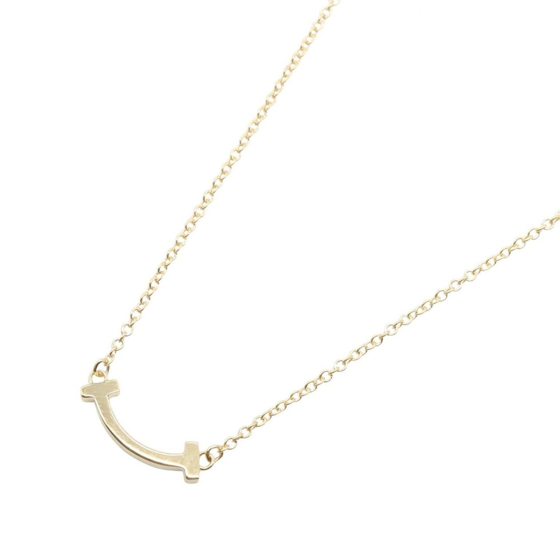 Tiffany & Co. T Smile Mini Necklace, 18K (Yellow Gold), Women's Jewelry, Gold Tone: --- Catalog ---Category: SizePendant Size: 3mm x 13mm / 0.11'' x 0.51''Neck Circumference: 40.5 cm - 45.5 cm / 15.94'' - 17.91''Category: DesignColor: GoldGender: WomenMaterial: Yellow gold (18K)Neckl