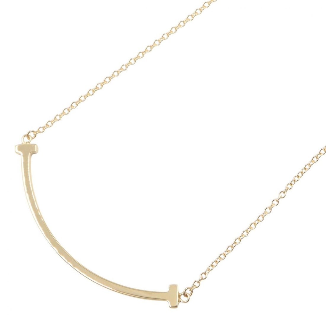 Tiffany & Co. T Smile Small Necklace, 18K (Yellow Gold), Women's Jewelry, Gold Tone: --- Catalog ---Category: SizePendant Size: 3mm x 37mm / 0.11'' x 1.45''Neck Circumference: 40.5 cm - 45.5 cm / 15.94'' - 17.91''Category: DesignColor: GoldGender: WomenMaterial: Yellow gold (18K)Neckl