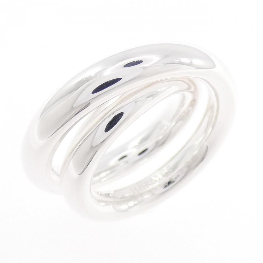 Hermes Vertige Ring: --- Catalog ---Category: SizeWidth: 9.9mm / 0.39''Weight: 14.4g / 0.5oz.JP Size: 7US Size: 4Category: DesignType: Band ringGender: WomenMaterial: Silver 925Category: GeneralBrand: Hermes--- Item List