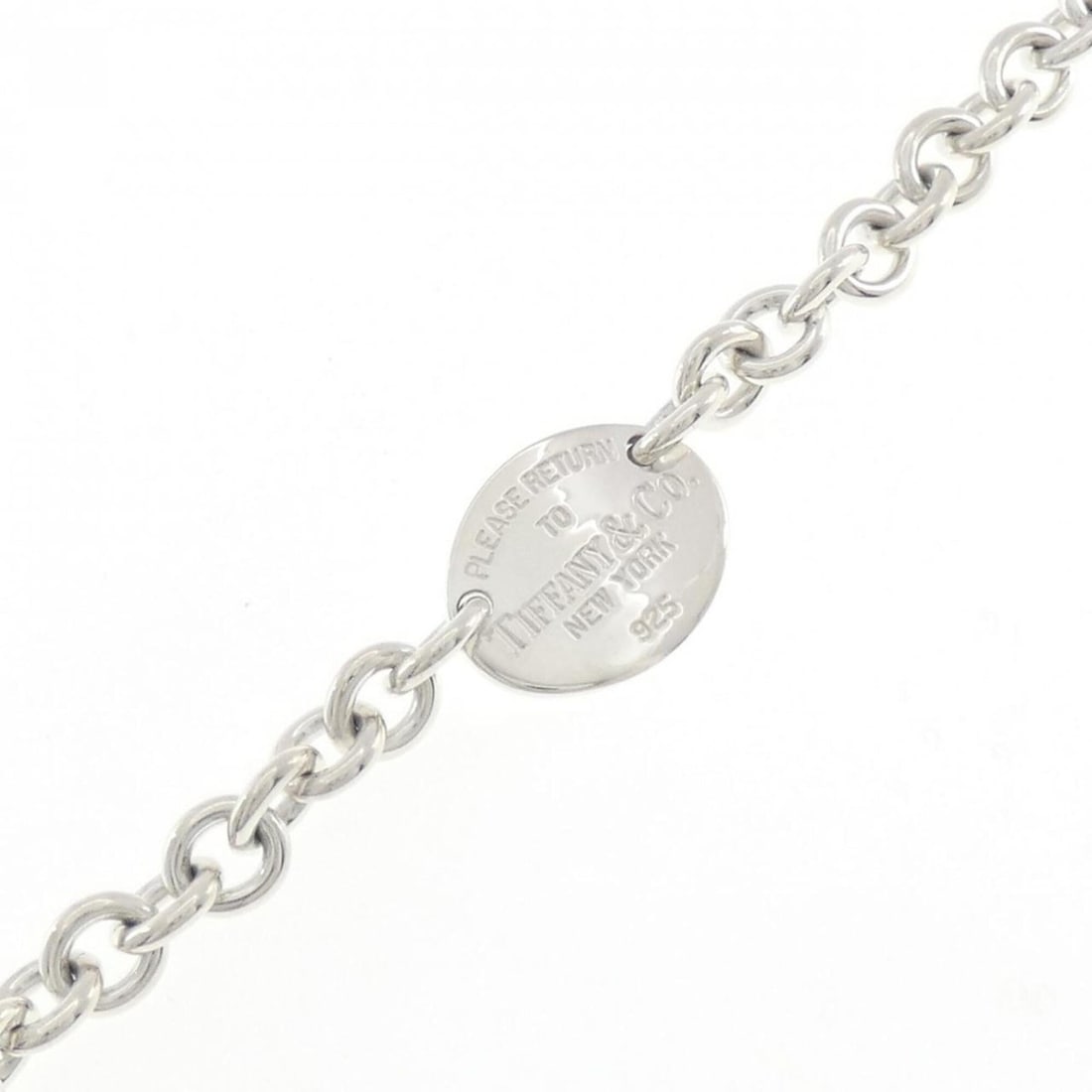 Tiffany & Co. Return to Oval Tag Bracelet: --- Catalog ---Category: SizeLength: 19cm / 7.48''Category: DesignType: Charm braceletGender: WomenMaterial: Silver 925Category: GeneralBrand: Tiffany--- Item List ---Section: ConditionRanking: Rank