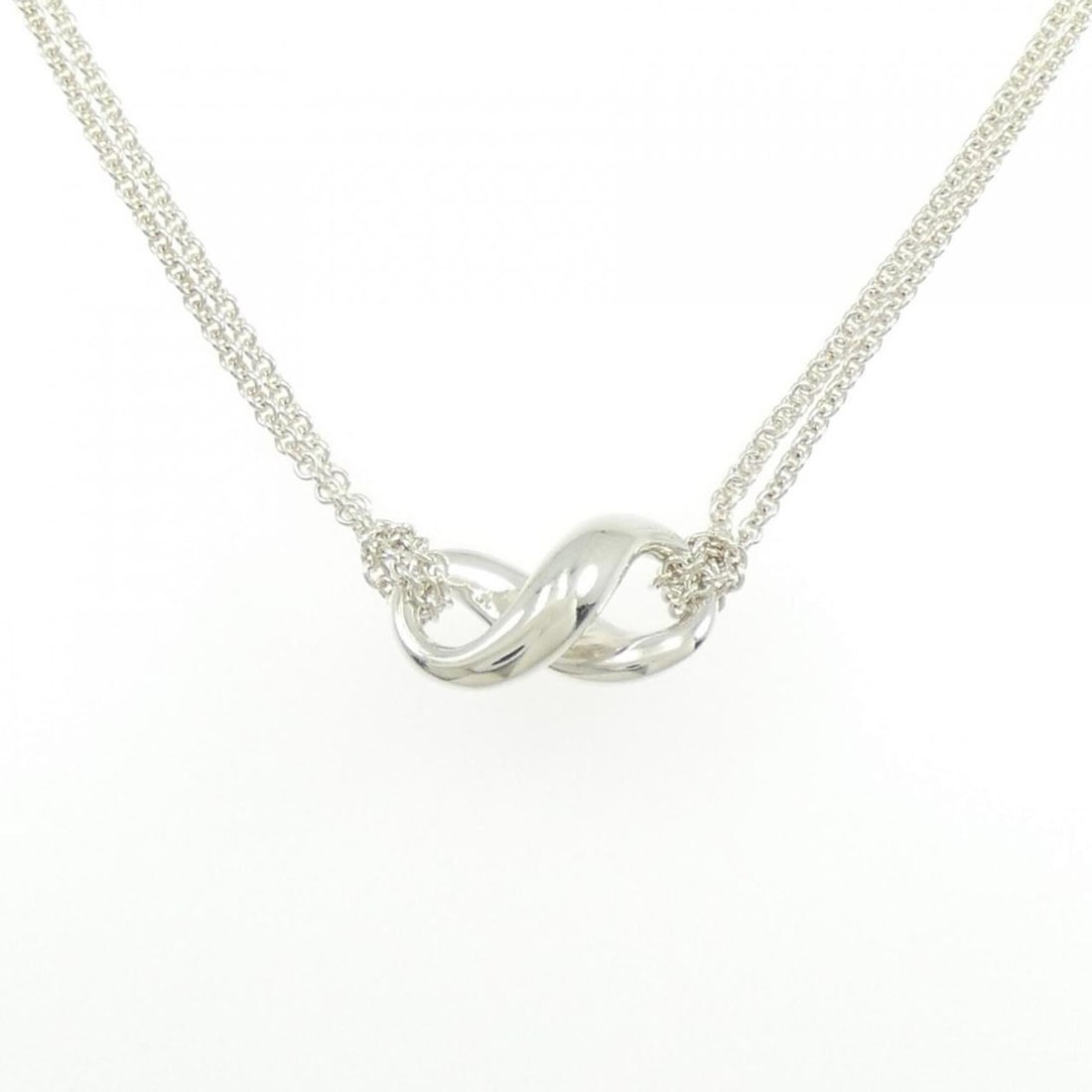 Tiffany & Co. Figure Eight Necklace: --- Catalog ---Category: SizeWidth: 1.6mm / 0.06''Weight: 7.4g / 0.26oz.Pendant Size: 9.5mm x 18.8mm / 0.37'' x 0.74''Neck Circumference: 40 cm / 15.74''Category: DesignGender: WomenMaterial: Silver