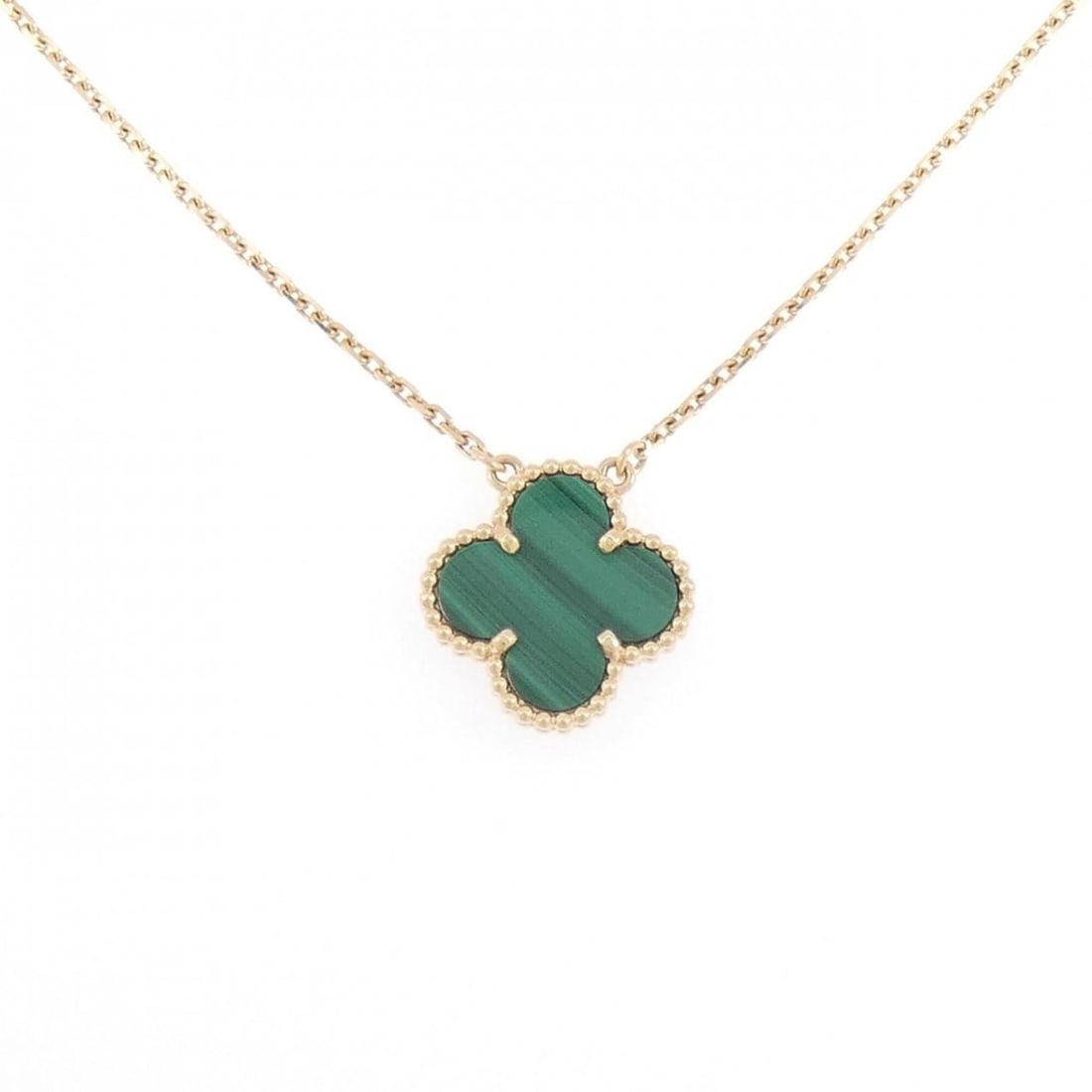 Van Cleef & Arpels Vintage Alhambra Necklace: --- Catalog ---Category: SizePendant Size: 14.8mm x 14.8mm / 0.58'' x 0.58''Neck Circumference: 38 cm - 42 cm / 14.96'' - 16.53''Category: DesignColor: Yellow goldStone: MalachiteGender: WomenMaterial