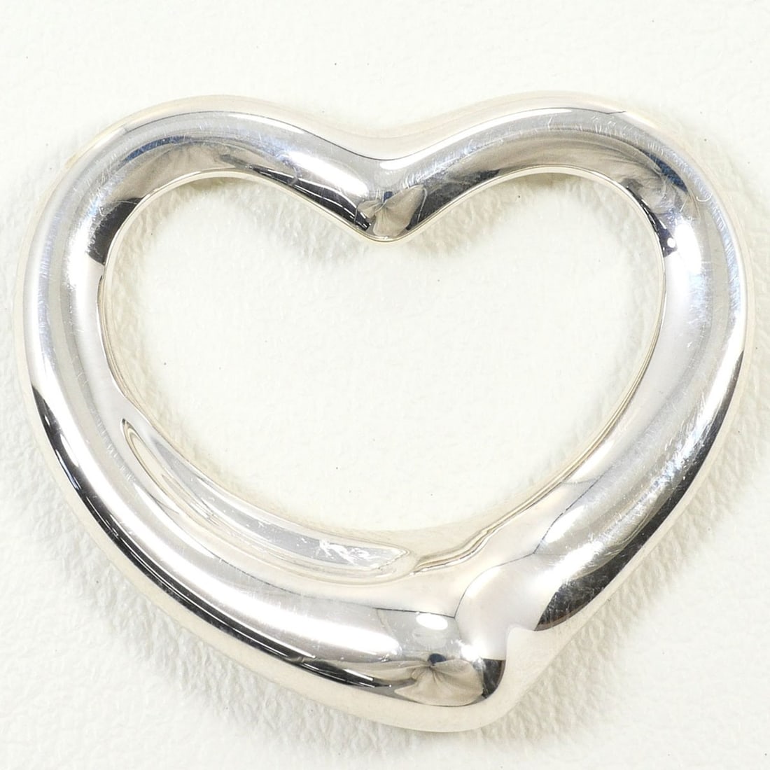 Tiffany & Co. Silver Open Heart Pendant Top, Total Weight 7.9g, Like New Condition, Free Gift: --- Catalog ---Category: SizePendant Size: 25mm x 26mm / 0.98'' x 1.02''Category: DesignColor: SilverGender: WomenPendant Type: PendantNecklace Type: PendantMaterial (Pendant): Silver 925Category: Gen