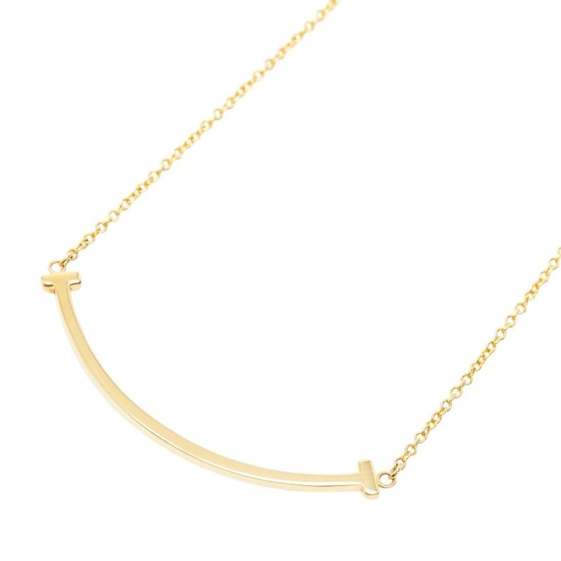 Tiffany & Co. T Smile Pendant Small Necklace 60011679 Gold 18KYG Yellow Women's: --- Catalog ---Category: SizePendant Size: 9mm x 36.8mm / 0.35'' x 1.44''Neck Circumference: 46.5 cm / 18.3''Category: DesignColor: Yellow goldGender: WomenMaterial: Yellow gold (18K)Necklace Type: Ne