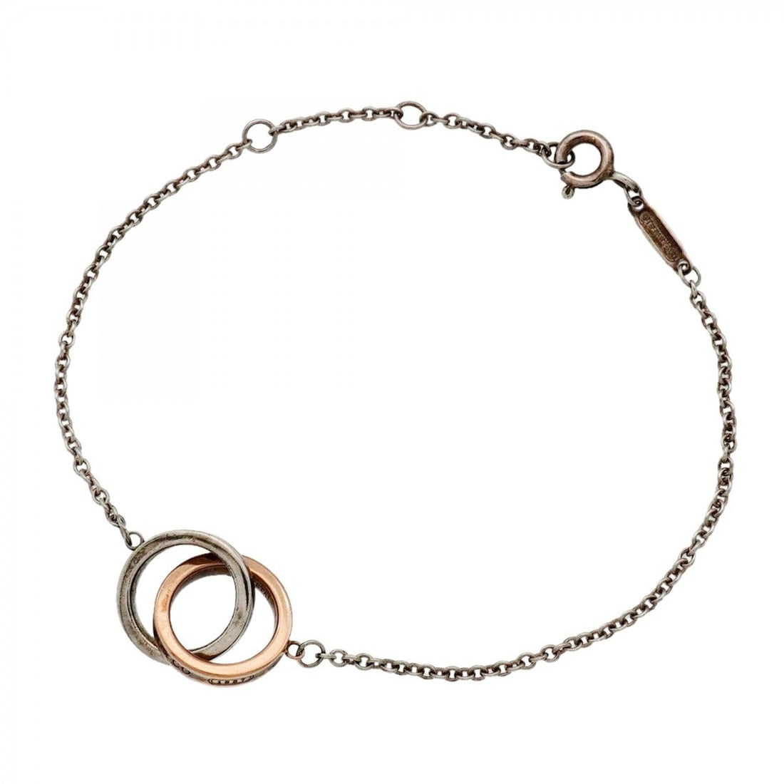 Tiffany & Co. Interlocking Bracelet, Sterling Silver 925, Rubedo Metal, Women's: --- Catalog ---Category: SizeLength: 17.5cm / 6.88''Category: DesignType: Charm braceletGender: WomenMaterial: Silver 925Category: GeneralBrand: Tiffany--- Item List ---Section: ConditionRanking: Rank