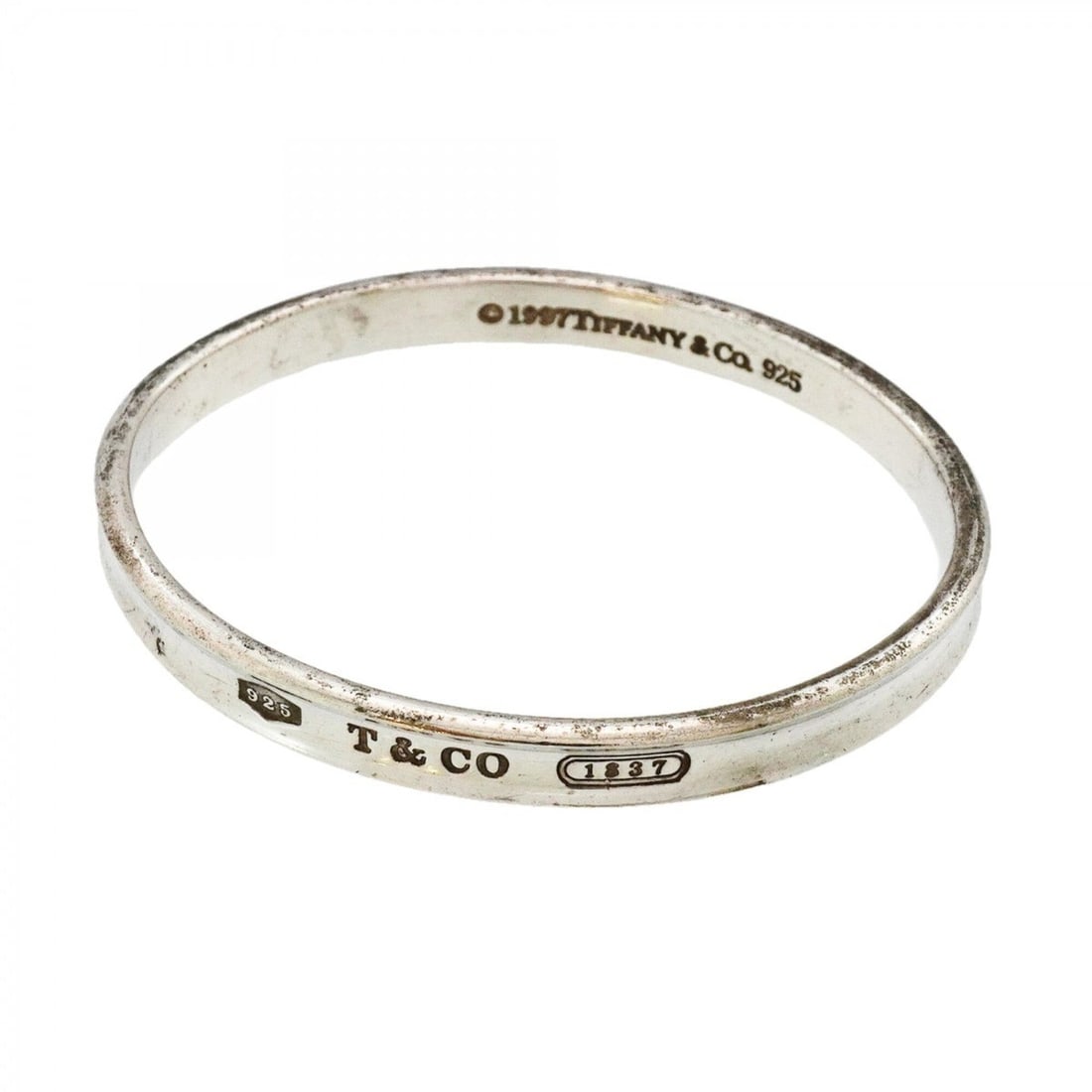 Tiffany & Co. Narrow Bangle, Sterling Silver 925, Men's: --- Catalog ---Category: SizeLength: 17.5cm / 6.88''Category: DesignType: BangleGender: MenMaterial: Silver 925Category: GeneralBrand: Tiffany--- Item List ---Section: ConditionRanking: Rank B Used - 