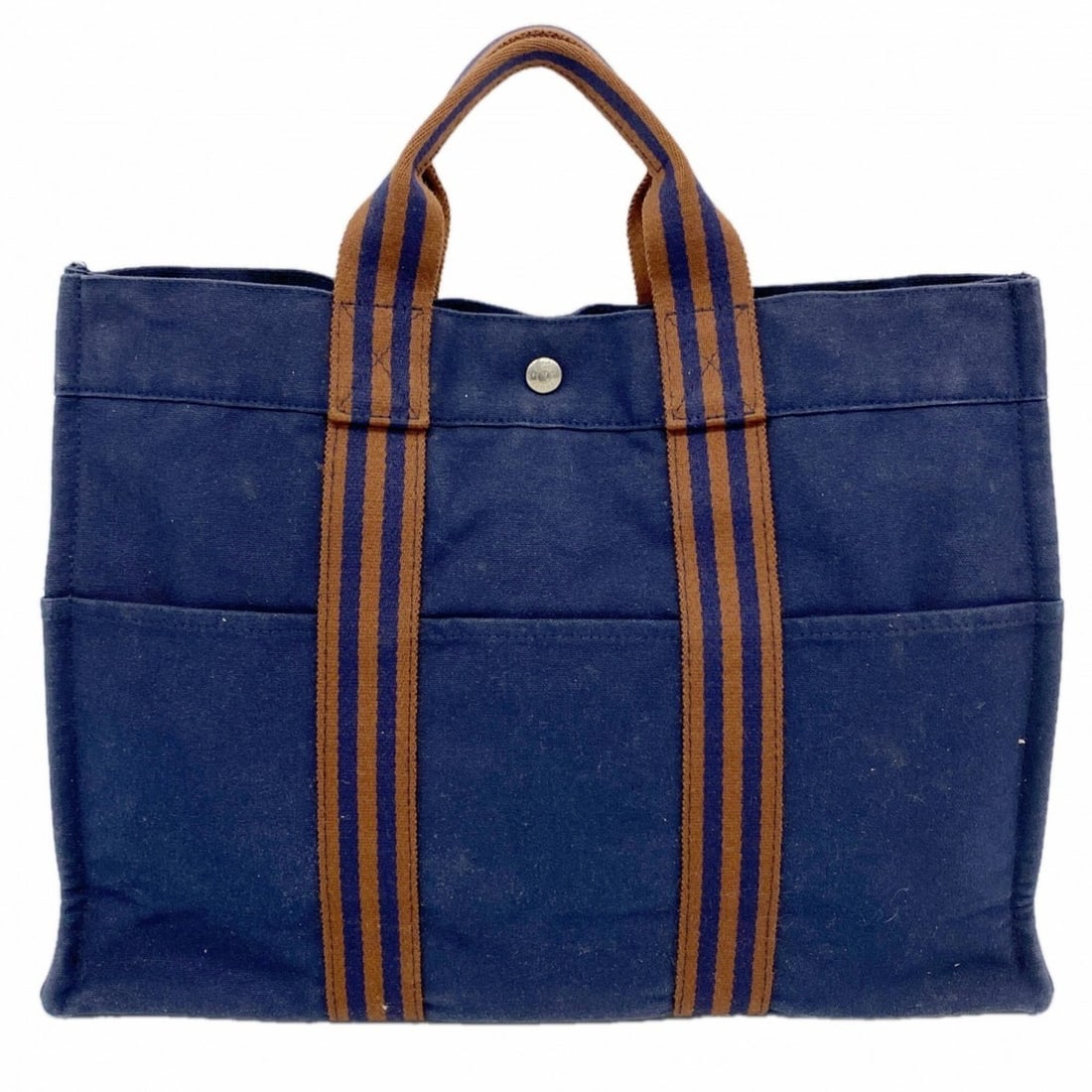 Hermes Fourre-Tout MM Canvas Tote Bag, Navy Brown, Men's & Women's: --- Catalog ---Category: SizeSize (HxWxD): 31cm x 42.5cm x 10cm / 12.2'' x 16.73'' x 3.93''Category: DesignType: Tote bagColor: Brown, NavyGender: Men,WomenMaterial: Canvas Hardware Color: SilverCateg