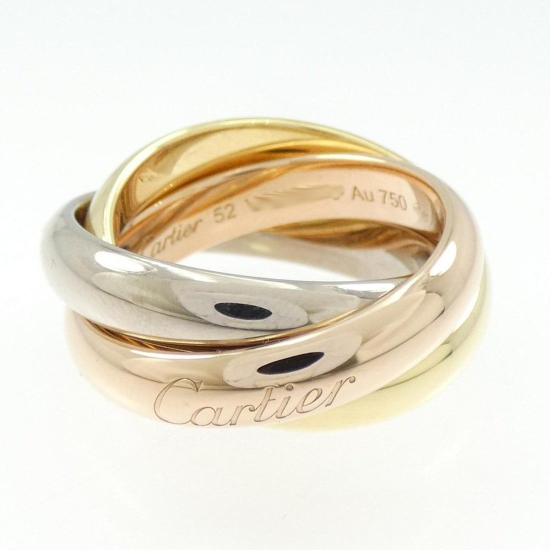 Cartier Trinity Large Ring: --- Catalog ---Category: SizeUS Size: 6.5Brand Size: 52Category: DesignType: Band ringColor: Pink gold, White gold, Yellow goldGender: WomenMaterial: Pink gold (18K), White gold (18K), Yellow gold