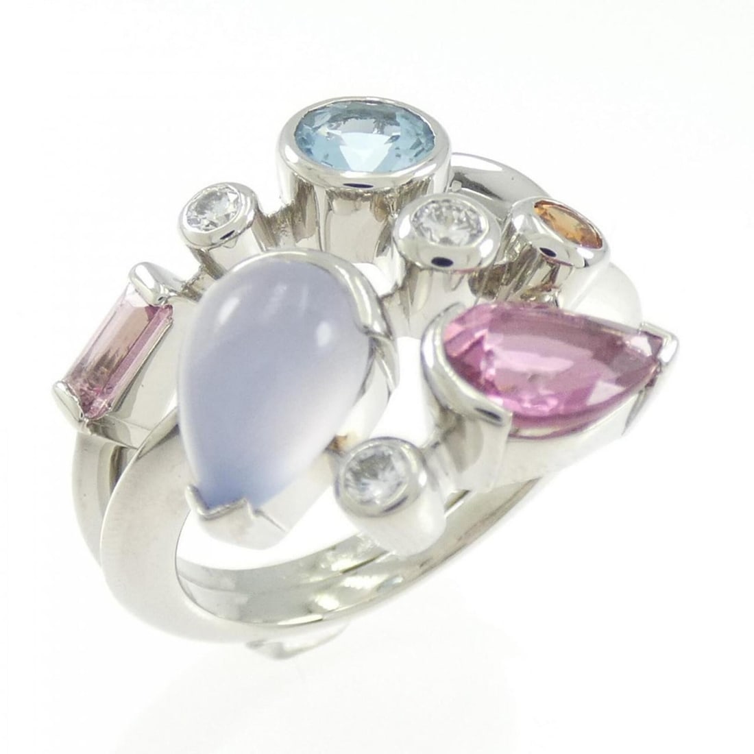 Cartier Meli-Melo Ring: --- Catalog ---Category: SizeUS Size: 6.5Brand Size: 52Category: DesignType: Band ringStone: Aquamarine, Chalcedony, Diamond, Garnet, TourmalineGender: WomenMaterial: Platinum 950Category: