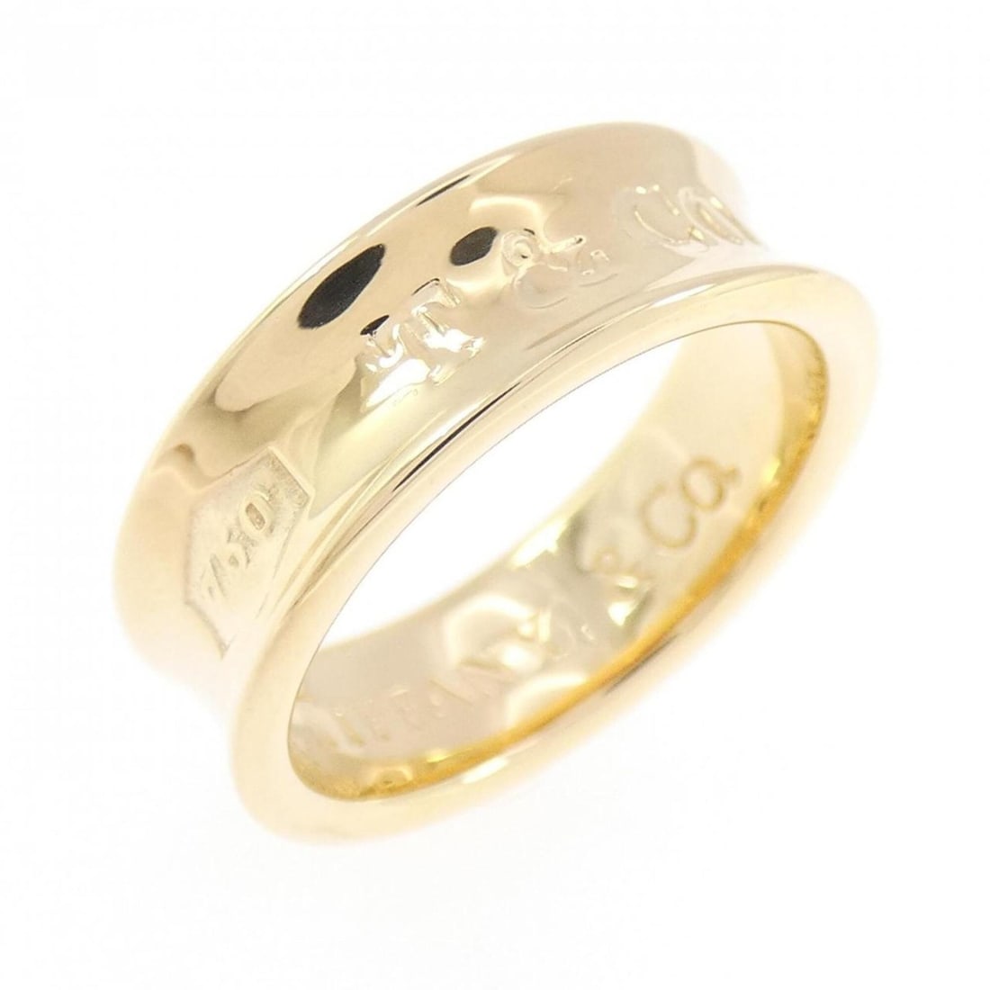 Tiffany & Co. 1837 Narrow Ring: --- Catalog ---Category: SizeJP Size: 9US Size: 5Category: DesignType: Band ringColor: Yellow goldGender: WomenMaterial: Yellow gold (18K)Category: GeneralBrand: Tiffany--- Item List ---Section: