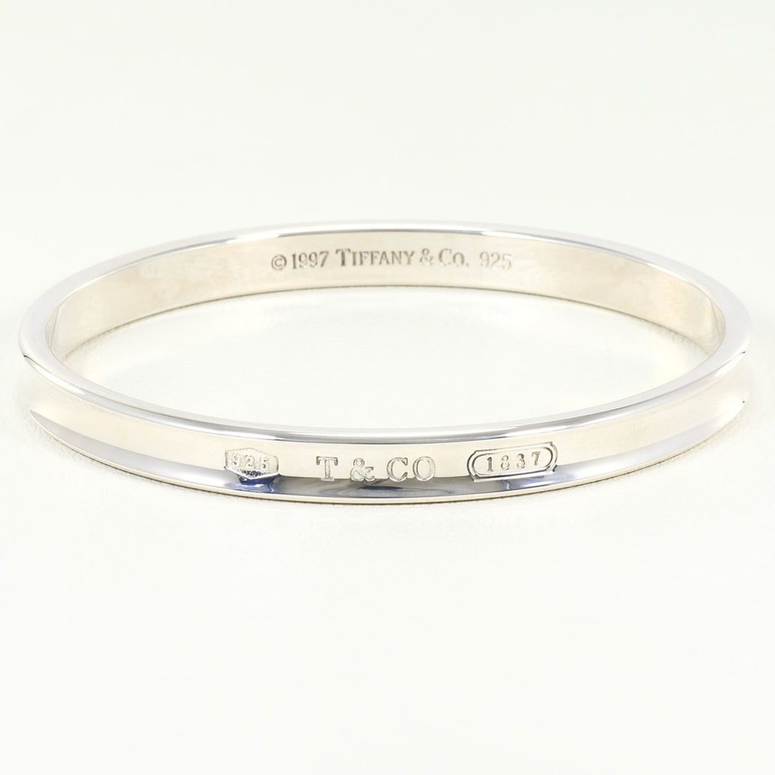 Tiffany & Co. 1837 Silver Bangle, Total Weight 34.0g, Like New Condition.: --- Catalog ---Category: SizeLength: 19cm / 7.48''Category: DesignType: BangleColor: SilverGender: WomenMaterial: Silver 925Category: GeneralBrand: Tiffany--- Item List ---Section: ConditionRanking: R