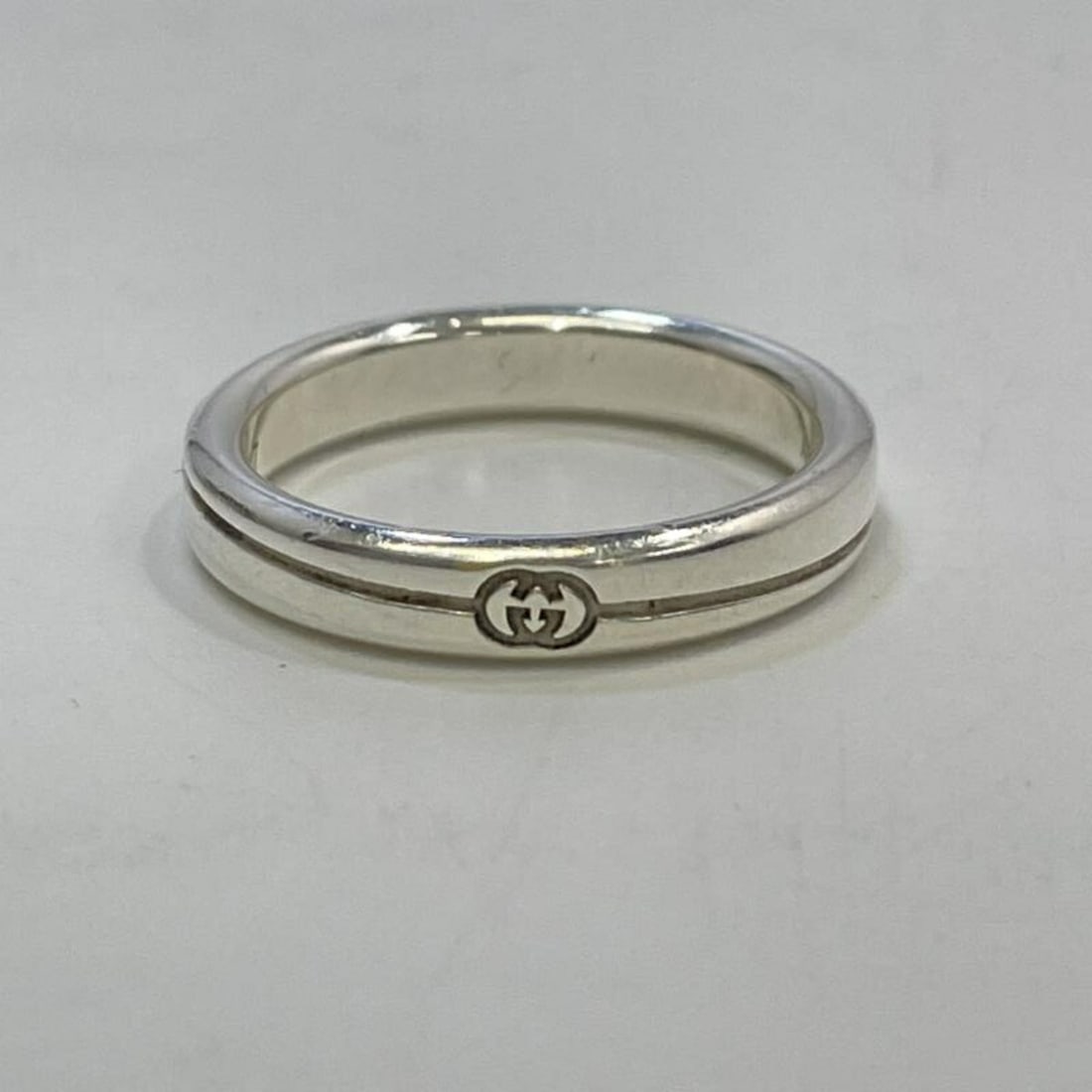 GUCCI Diagonal Interlocking G Ring, Gucci Ag925: --- Catalog ---Category: SizeJP Size: 17US Size: 8.5Category: DesignColor: SilverGender: WomenCategory: GeneralBrand: Gucci--- Item List ---Section: ConditionRanking: Rank AB Used - Traces of usage, s