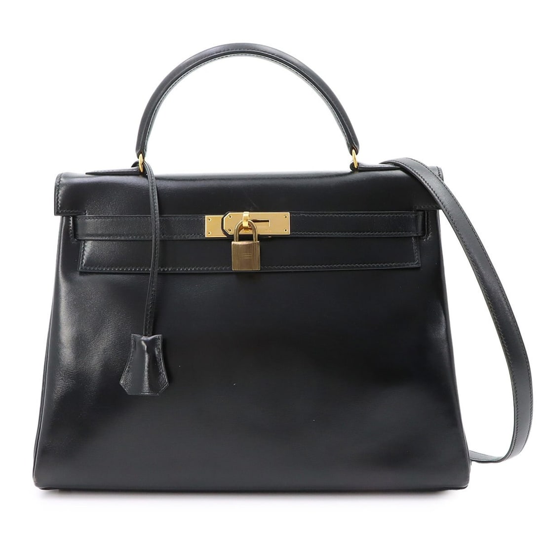 Hermes Kelly 32 Box Calf Black 2-way Hand/Shoulder Handbag, Inside Stitching, ?N Stamp, Made in: --- Catalog ---Category: SizeSize (HxWxD): 22cm x 31.5cm x 12cm / 8.66'' x 12.4'' x 4.72''Category: DesignType: HandbagColor: BlackGender: WomenMaterial: Box calf leather Category: GeneralBrand: Herme