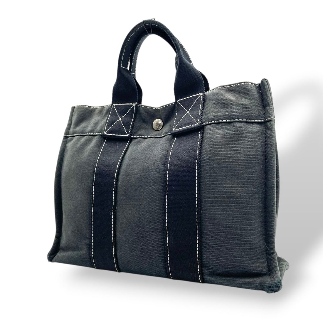 Hermes Fourre-Tout PM Canvas Tote Bag, Navy/Black with Silver Hardware, Handbag for Men and Women,: --- Catalog ---Category: SizeSize (HxWxD): 21cm x 29cm x 7cm / 8.26'' x 11.41'' x 2.75''Category: DesignType: Handbag, Tote bagColor: Black, NavyGender: Men,WomenMaterial: Cotton canvas , Cotton Categ