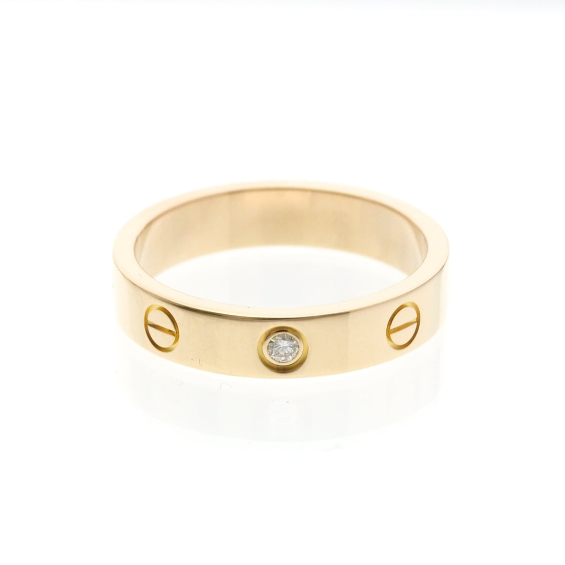 Cartier Mini Love Ring With 1 Diamond Pink Gold (18K) Fashion Diamond Band Ring Pink Gold: --- Catalog ---Category: SizeWidth: 4mm / 0.16''Weight: 4.7g / 0.16oz.JP Size: 13US Size: 6 1/4Brand Size: 53Category: DesignType: Band ringColor: Pink goldMetal: GoldStone: DiamondStyle: FashionGende