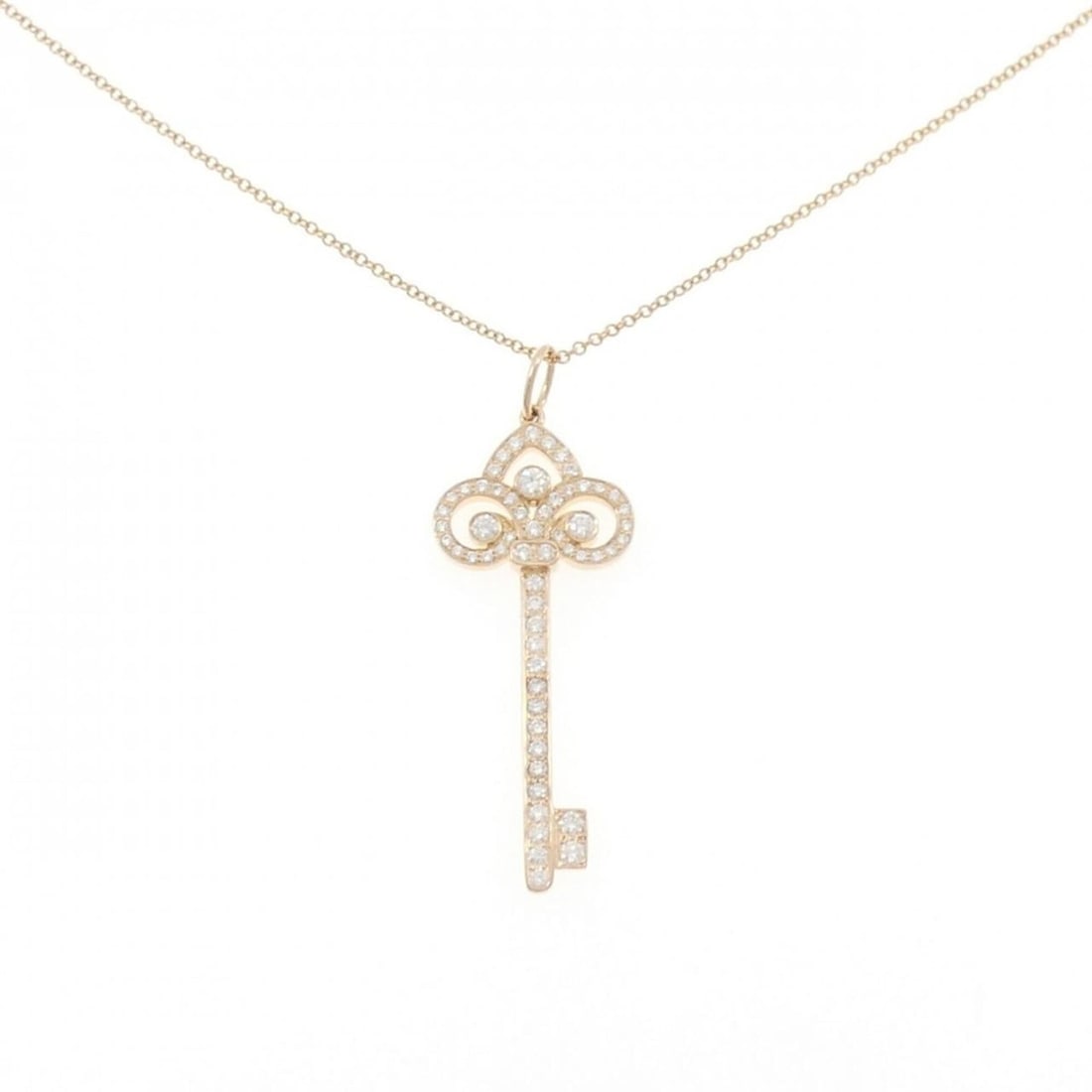 Tiffany & Co. Fleur de Lis Key Necklace: --- Catalog ---Category: SizePendant Size: 41.4mm x 14.9mm / 1.62'' x 0.58''Neck Circumference: 41 cm / 16.14''Category: DesignStone: DiamondGender: WomenMaterial: Pink gold (18K)Pendant Type: Pendant