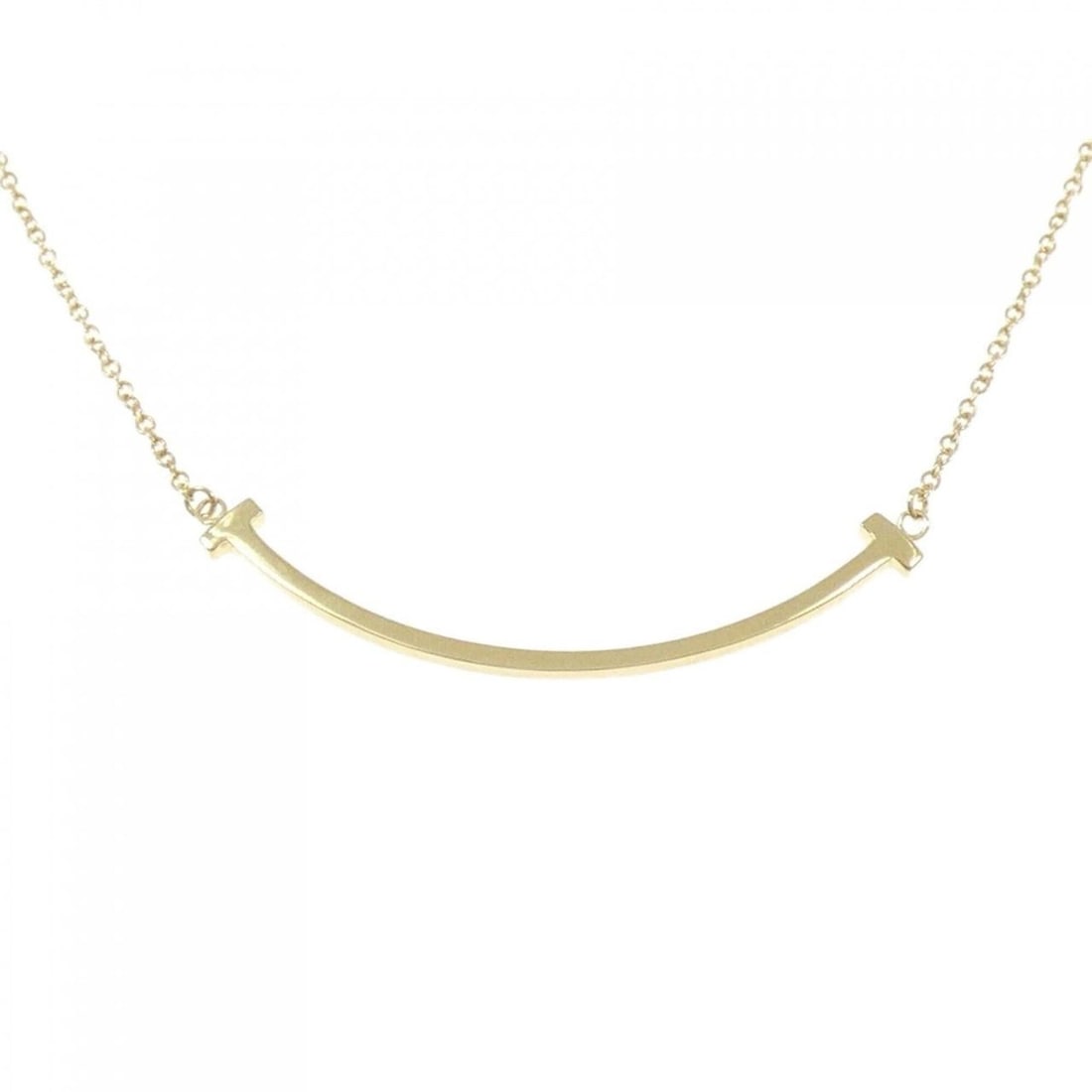 Tiffany T Smile Small Necklace: --- Catalog ---Category: SizePendant Size: 3.7mm x 36.7mm / 0.14'' x 1.44''Neck Circumference: 40 cm - 46 cm / 15.74'' - 18.11''Category: DesignGender: WomenMaterial: Yellow gold (18K)Pendant Type: Pe