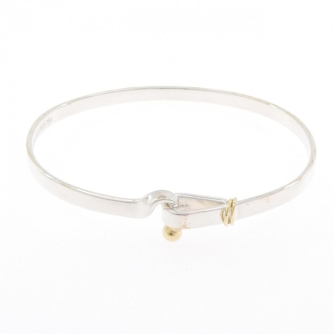 Tiffany Hook & Eye Bangle: --- Catalog ---Category: SizeLength: 18cm / 7.08''Category: DesignType: BangleColor: Silver, Yellow goldGender: WomenClosure: HookMaterial: Silver 925, Yellow gold (18K)Category: GeneralBrand: Tiffany