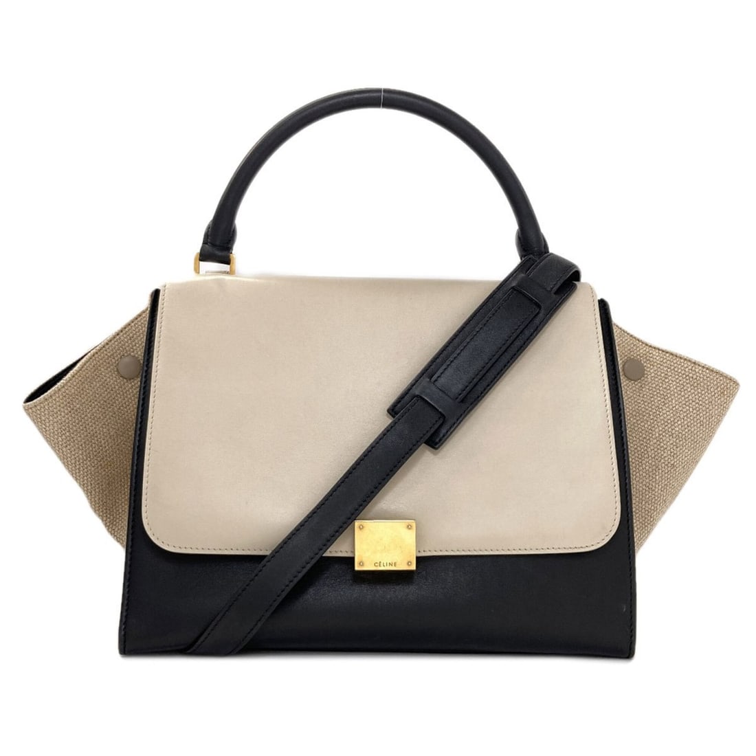 Celine Trapeze Medium 2-Way Handbag, Calfskin, Women's.: --- Catalog ---Category: SizeSize (HxWxD): 25cm x 51cm x 17.5cm / 9.84'' x 20.07'' x 6.88''Strap Length: 78cm / 30.7''Handle Length: 31cm / 12.2''Category: DesignType: HandbagColor: Black, WhiteGender
